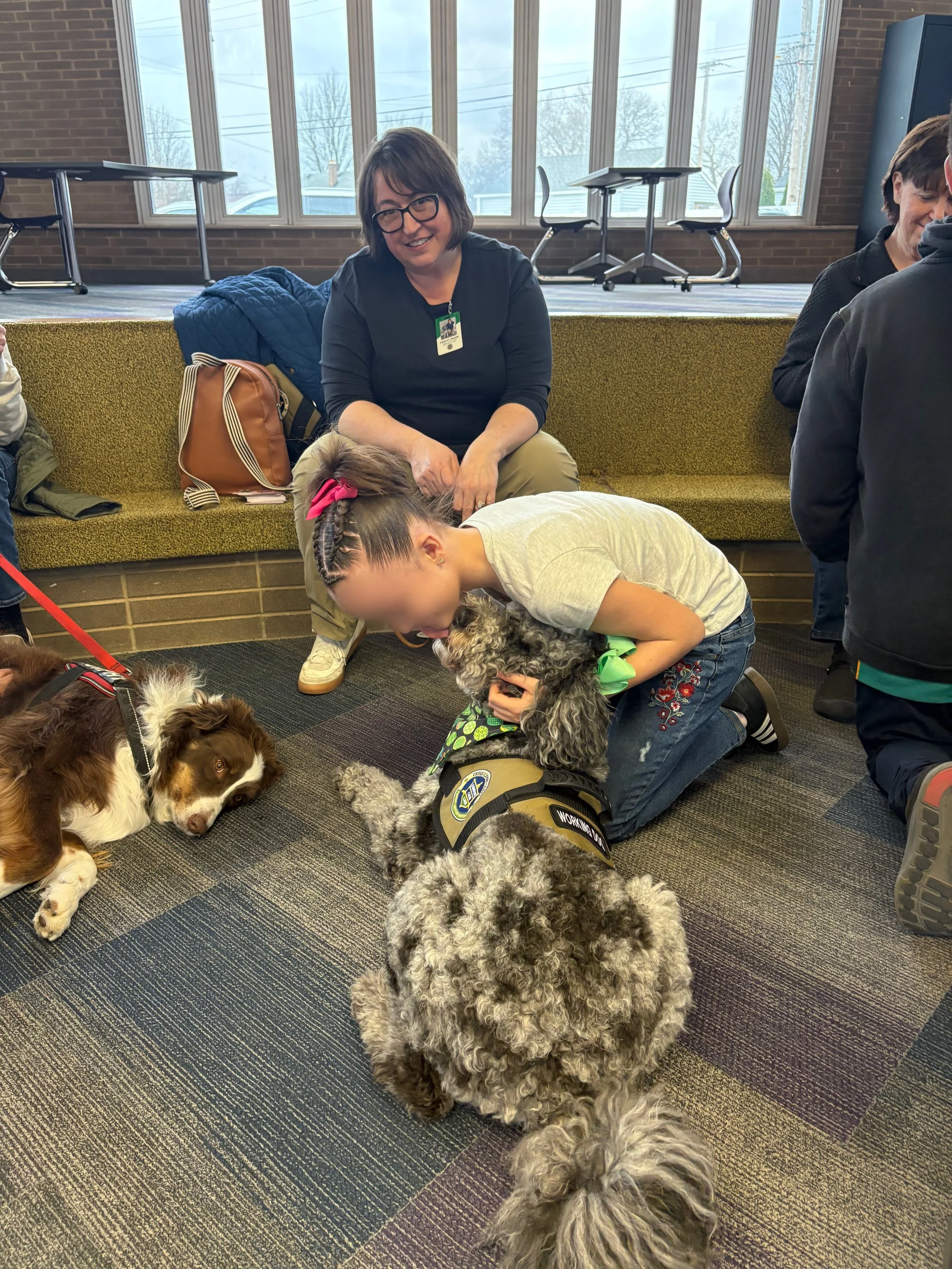 Let's "Paws" and Read Together - Annual interactive family reading night as 'One Book, One School' celebration kicks off in honor of a beloved teacher who shares her love of reading and dogs with the school.