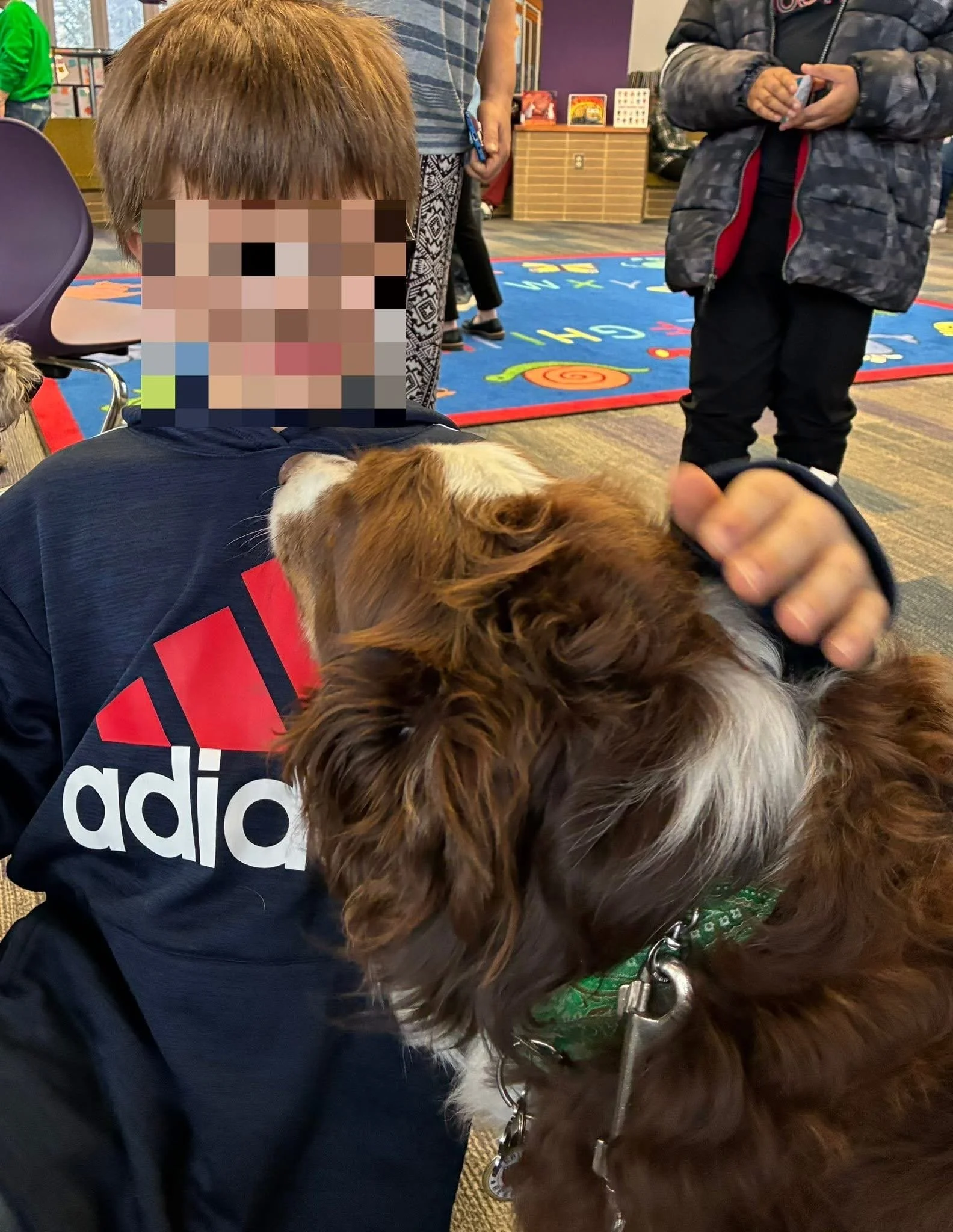 Let's "Paws" and Read Together - Annual interactive family reading night as 'One Book, One School' celebration kicks off in honor of a beloved teacher who shares her love of reading and dogs with the school.