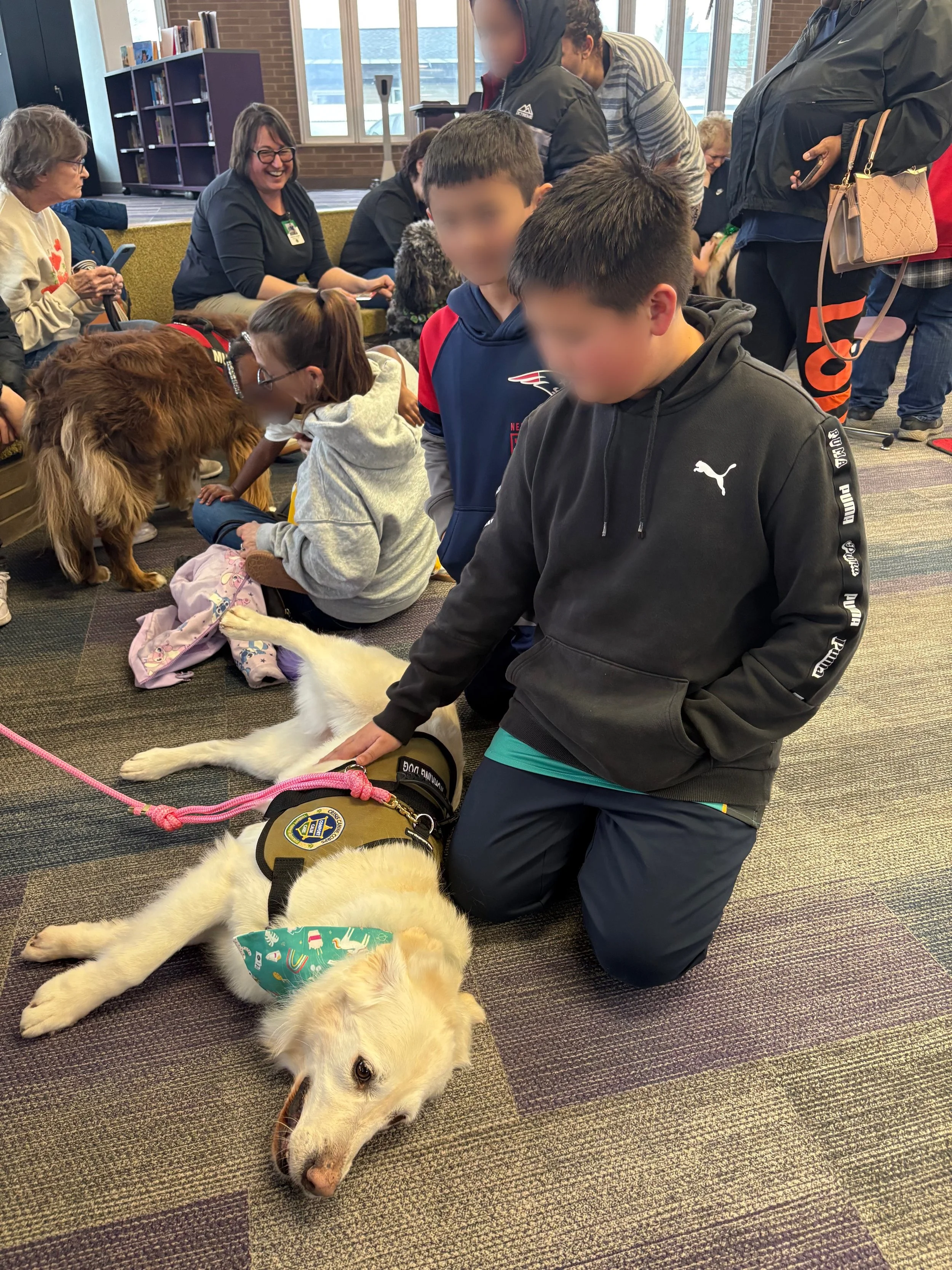 Let's "Paws" and Read Together - Annual interactive family reading night as 'One Book, One School' celebration kicks off in honor of a beloved teacher who shares her love of reading and dogs with the school.