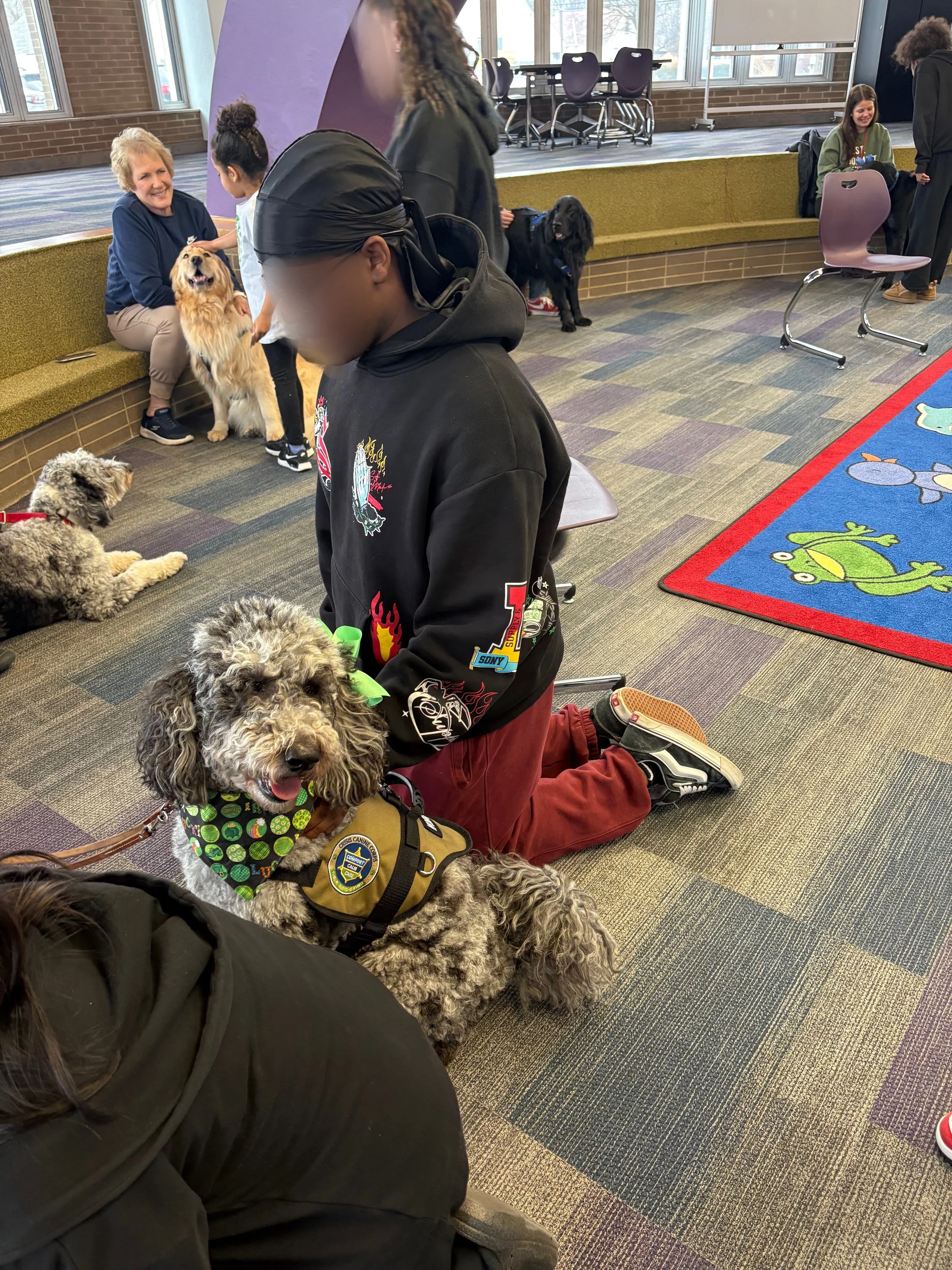 Let's "Paws" and Read Together - Annual interactive family reading night as 'One Book, One School' celebration kicks off in honor of a beloved teacher who shares her love of reading and dogs with the school.