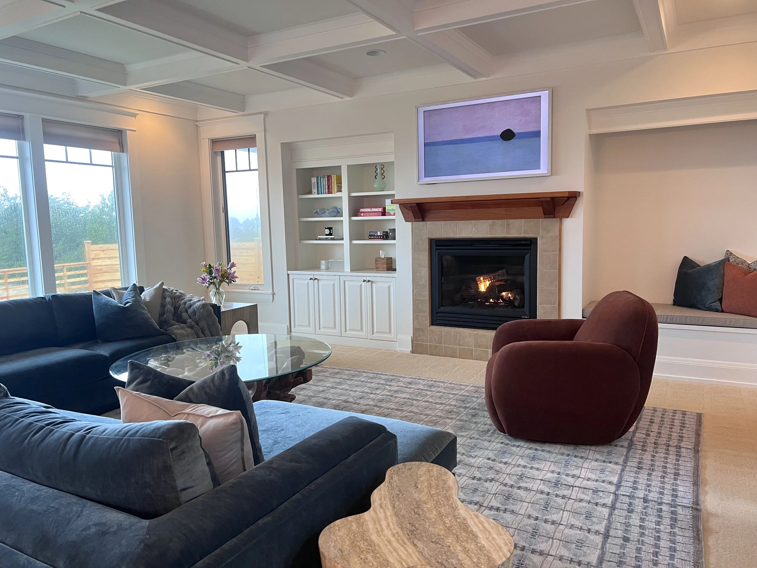 Windows open to the ocean. Evenings settle in around the fire.