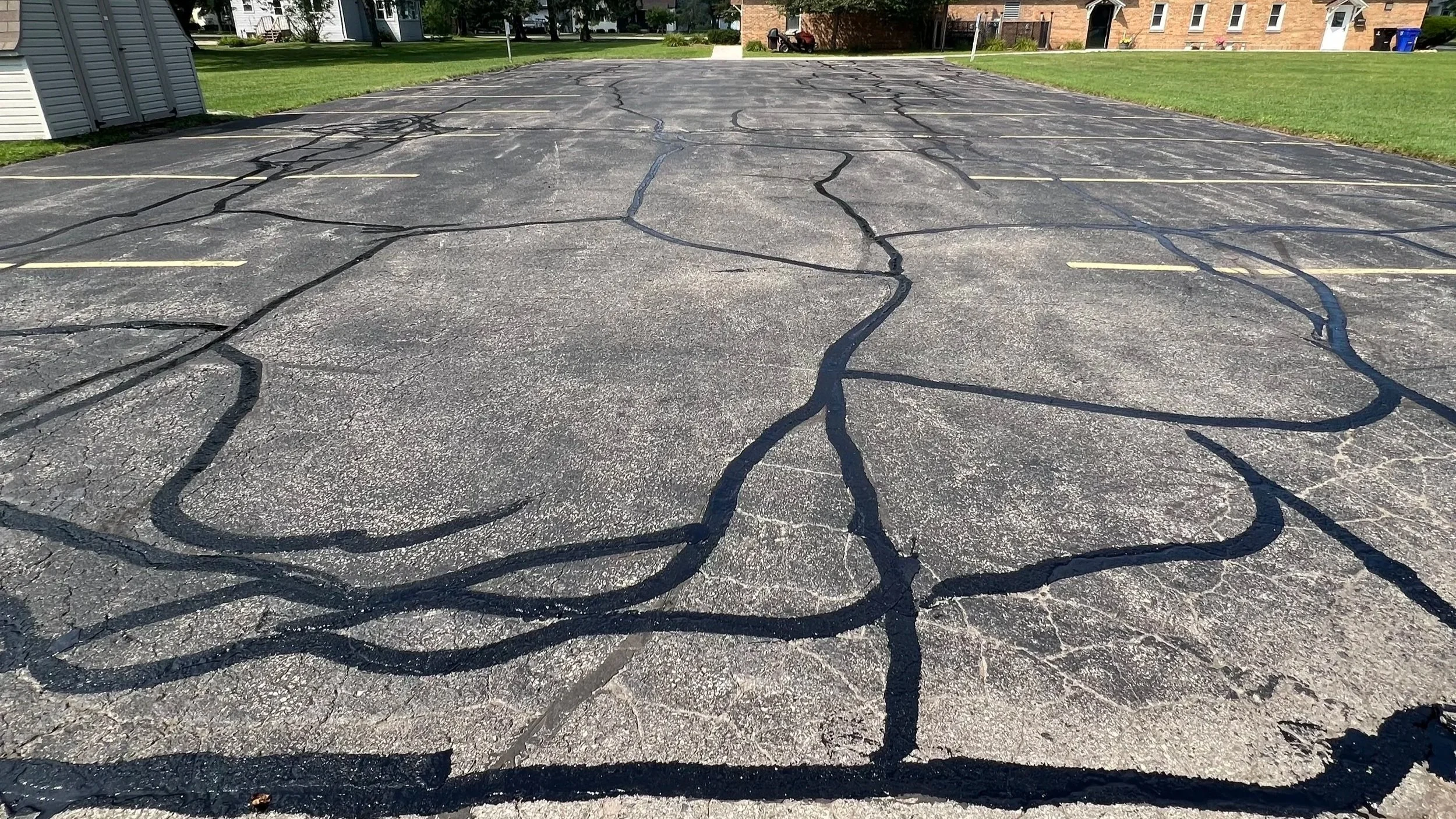 Asphalt crack filling on residential driveways and commercial parking lots in Green Bay Wisconsin