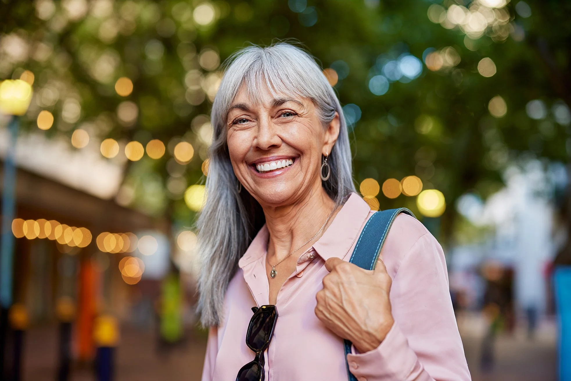 Smiling mature woman in outdoor pedstrian mall setting