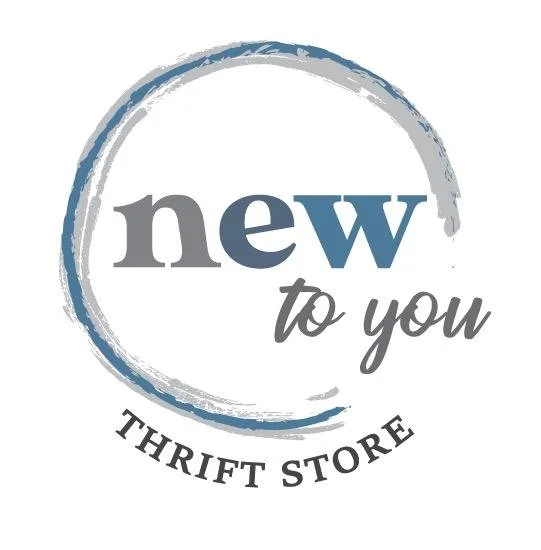 Logo for a thrift store called 'New to You', featuring a circular brushstroke design and text.