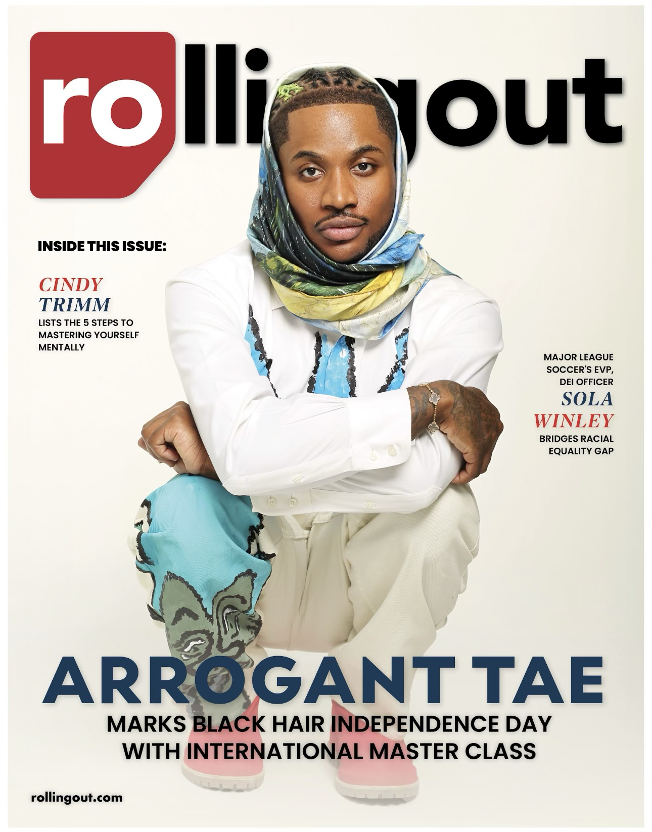 Cover of Rolling Out magazine featuring Arrogant Tae, a fashion designer, with a colorful scarf around his head, white shirt with blue and black accents, beige pants, and pink shoes. The magazine highlights articles about black hair, racial equality,