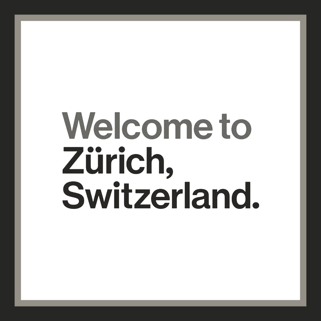Willkommensschild mit der Aufschrift "Welcome to Zürich, Switzerland" in Schwarz auf weißem Hintergrund, eingerahmt.