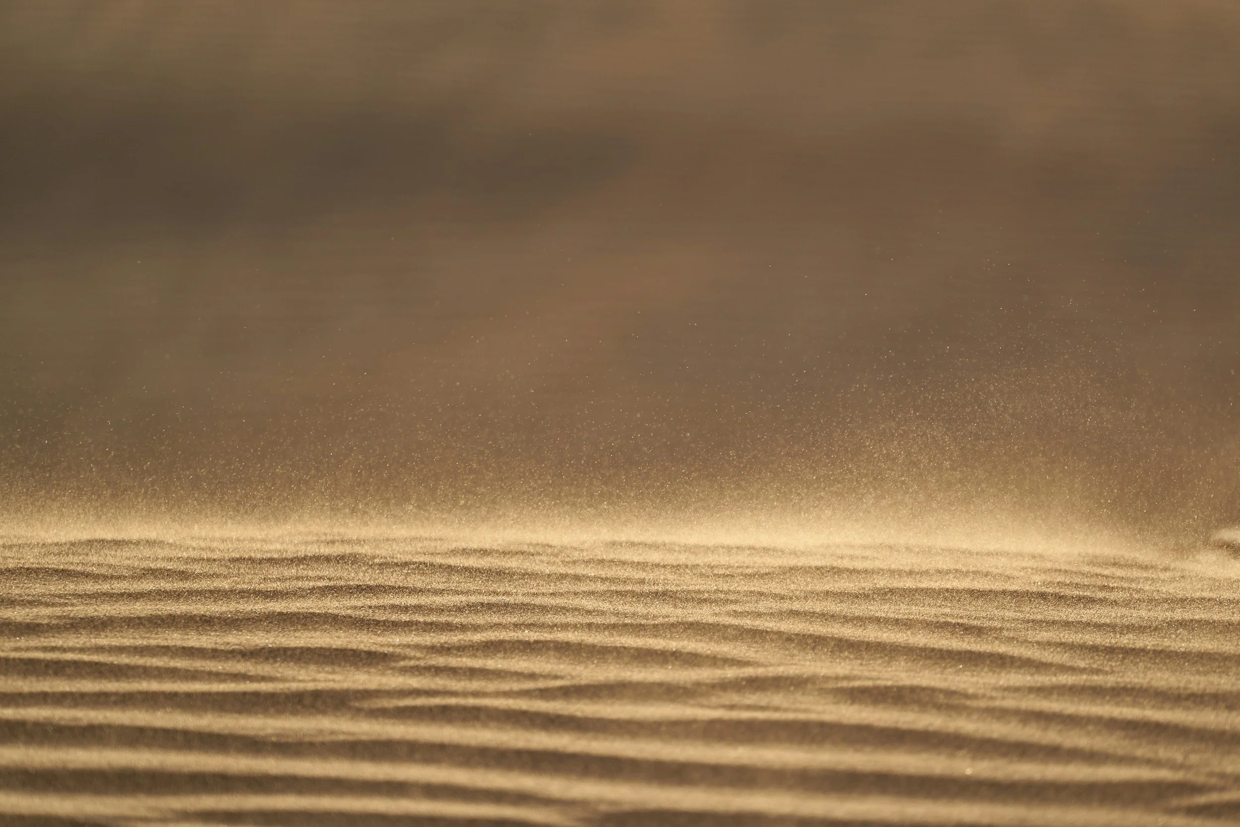 Warm, golden sand image used on the Grief page.