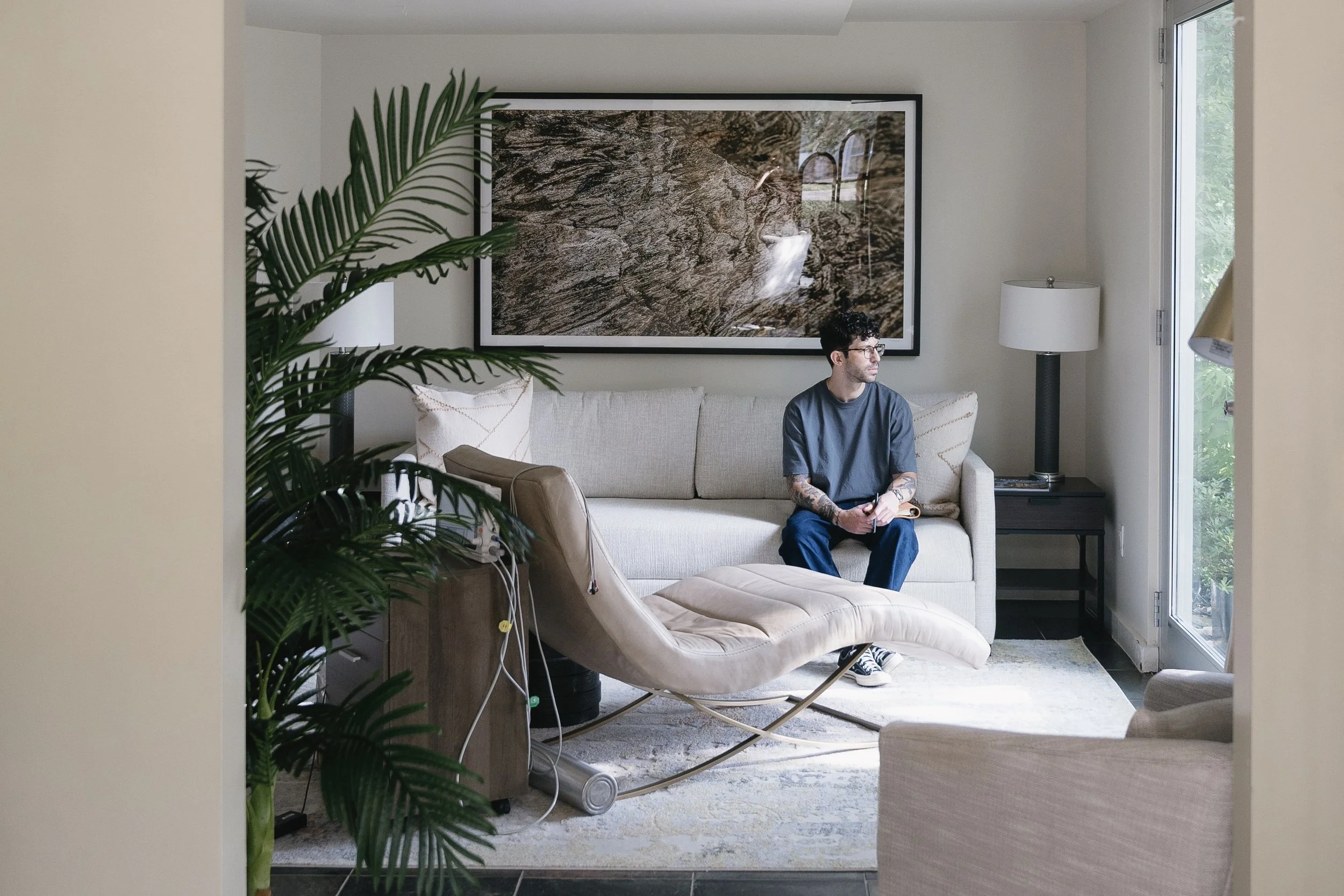 Josh Shifrin sitting in the therapy space used for Ketamine-Assisted Psychotherapy in Austin.