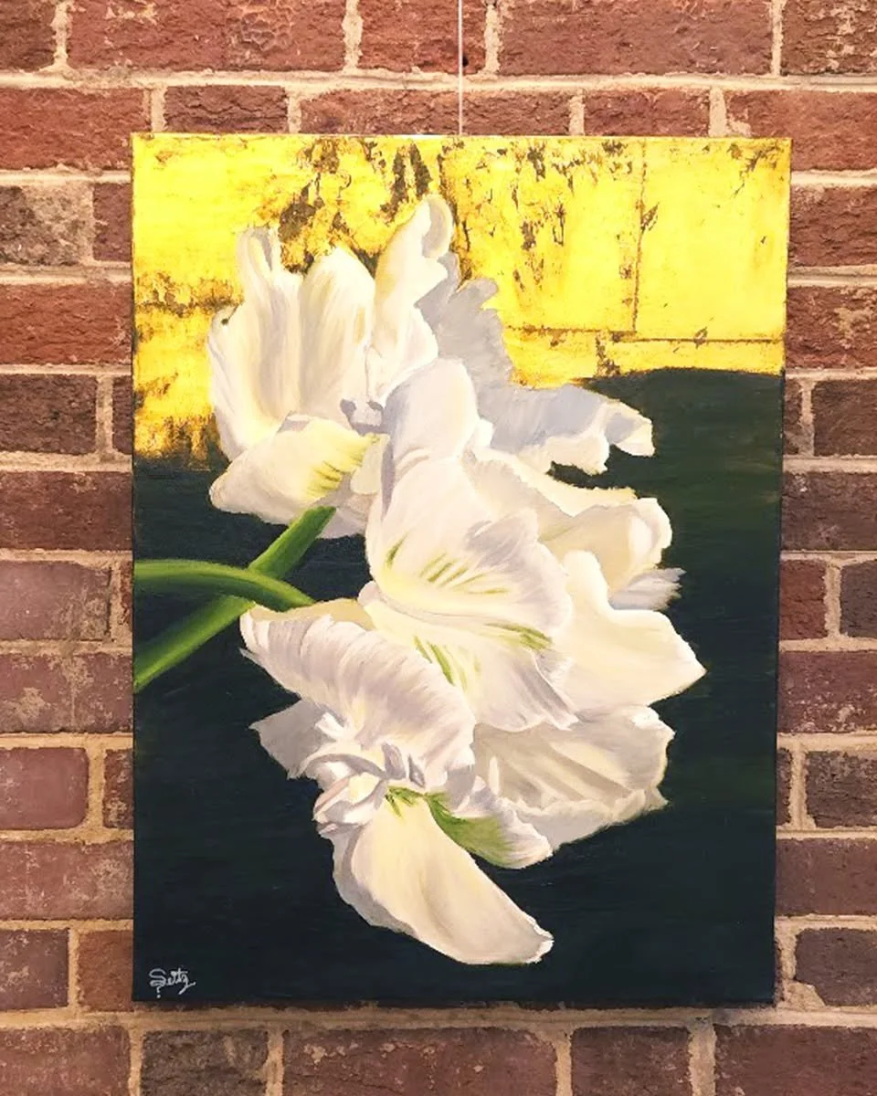 This triptych features white tulips set against a background of dark olive green, brown, and gold foil. Artist Taylor Seitz (@seitzfineart) once again shows off her skills with oil paint and gold leaf.

Sold as a set of 3.
On view and available for s
