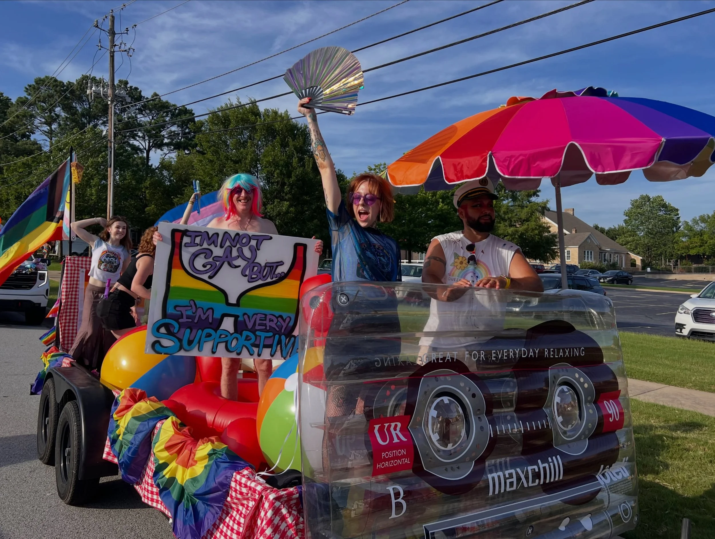 This is the story behind The Float. 💕💅

We wanted to create a Pride parade float that showcased how much we love our community. Instead of buying new materials, we repurposed what we already loved. The tablecloths lining the float once dressed the 