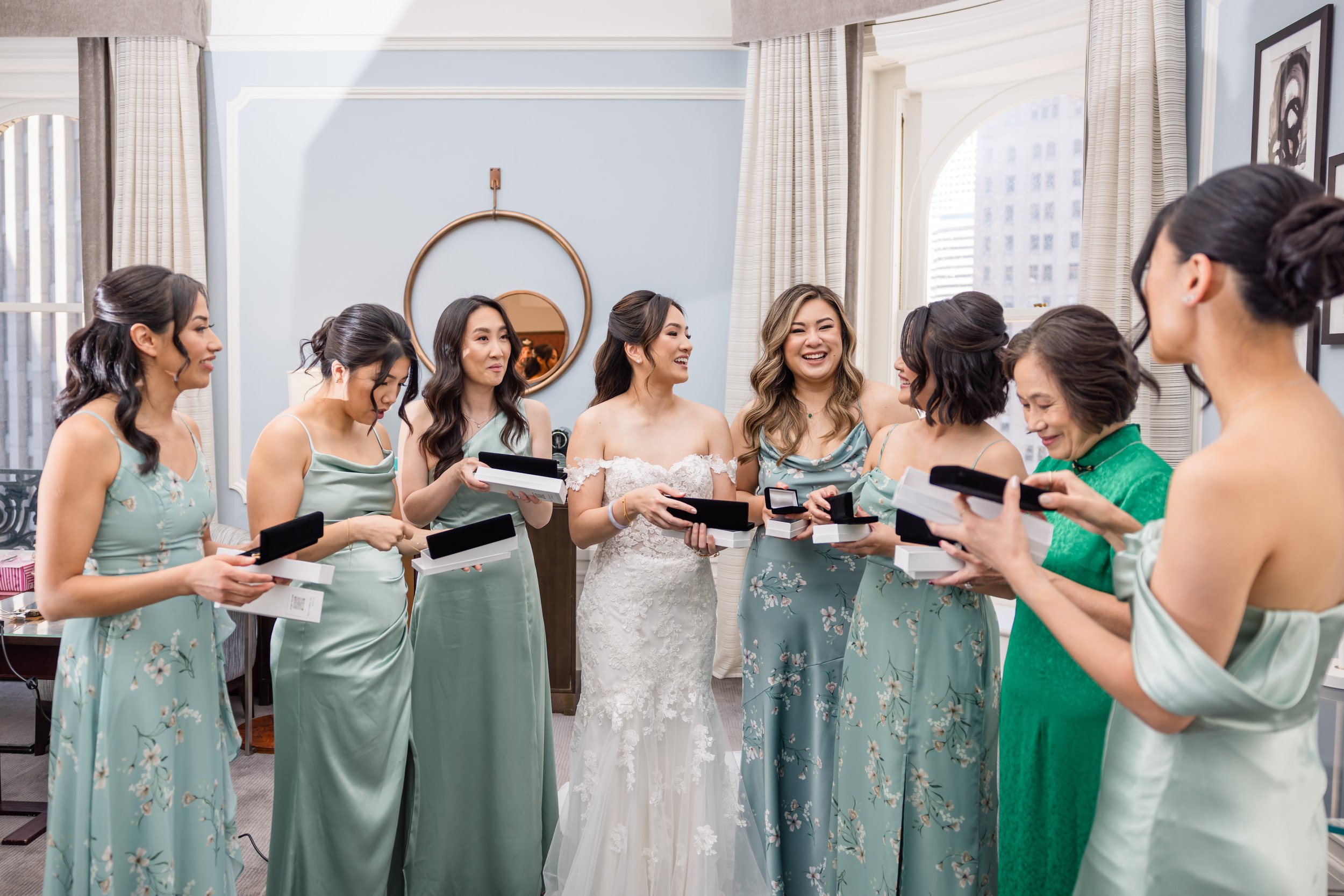 Bride and bridesmaids smiling happy opening custom pearl jewelry gifts by Delphiq Jewelry