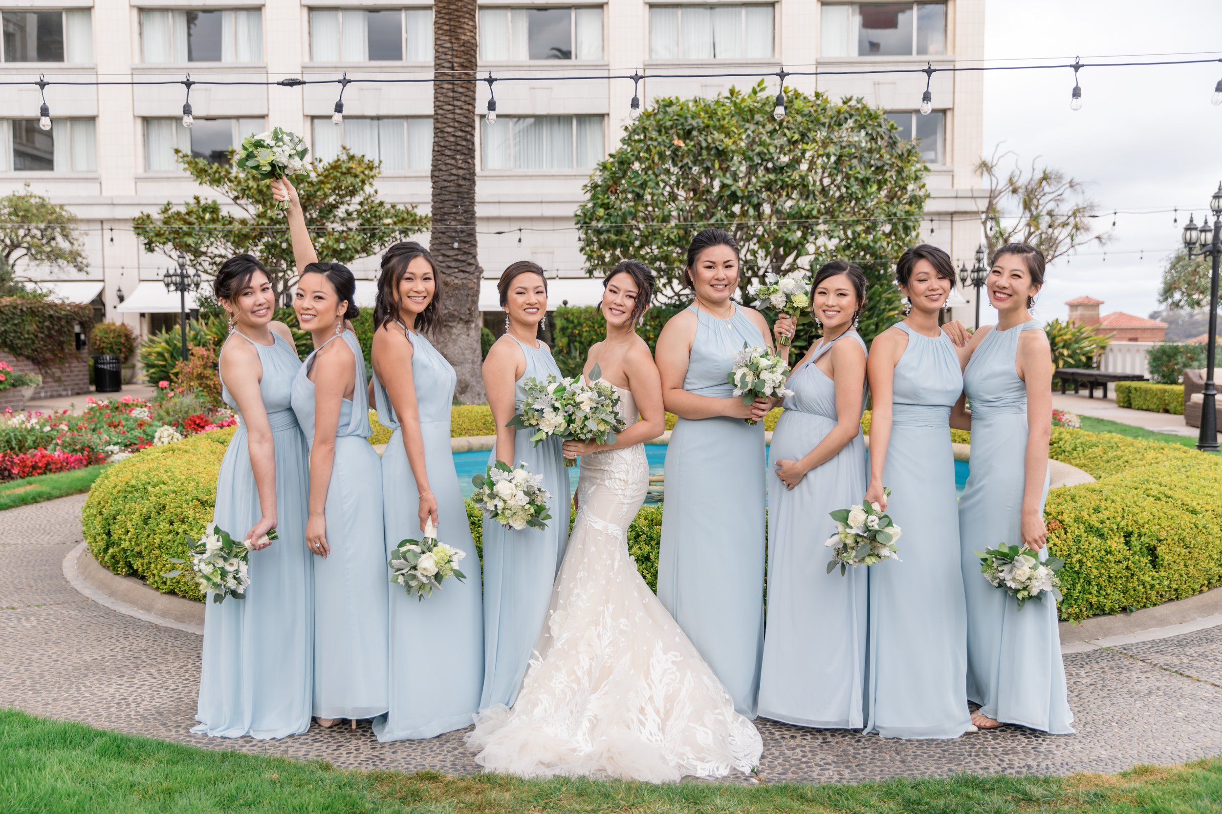 Bridesmaids wearing custom pearl bridesmaid earrings by San Francisco wedding jewelry designer Delphiq Jewelry