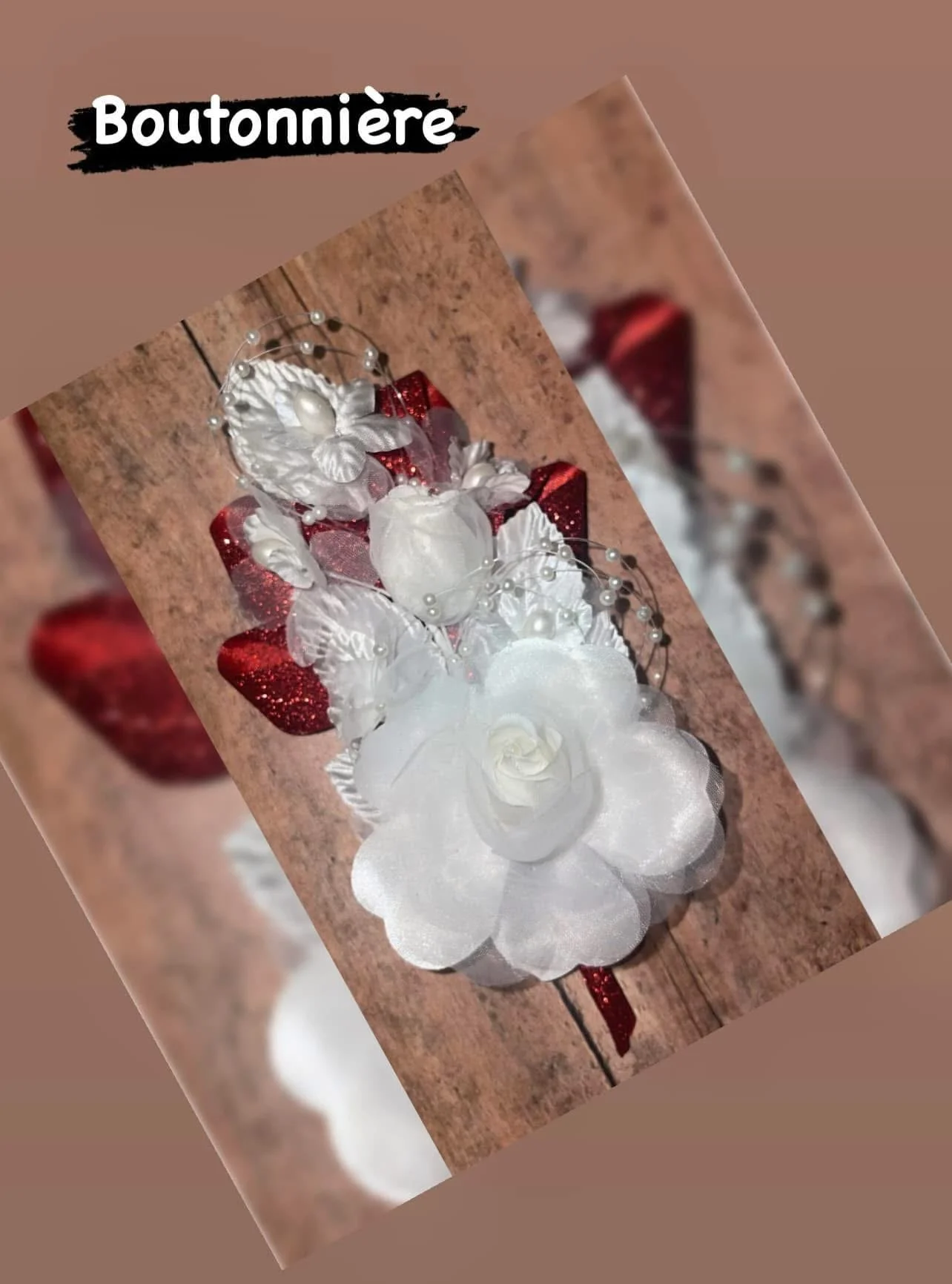 Overhead view of white and red boutonniere