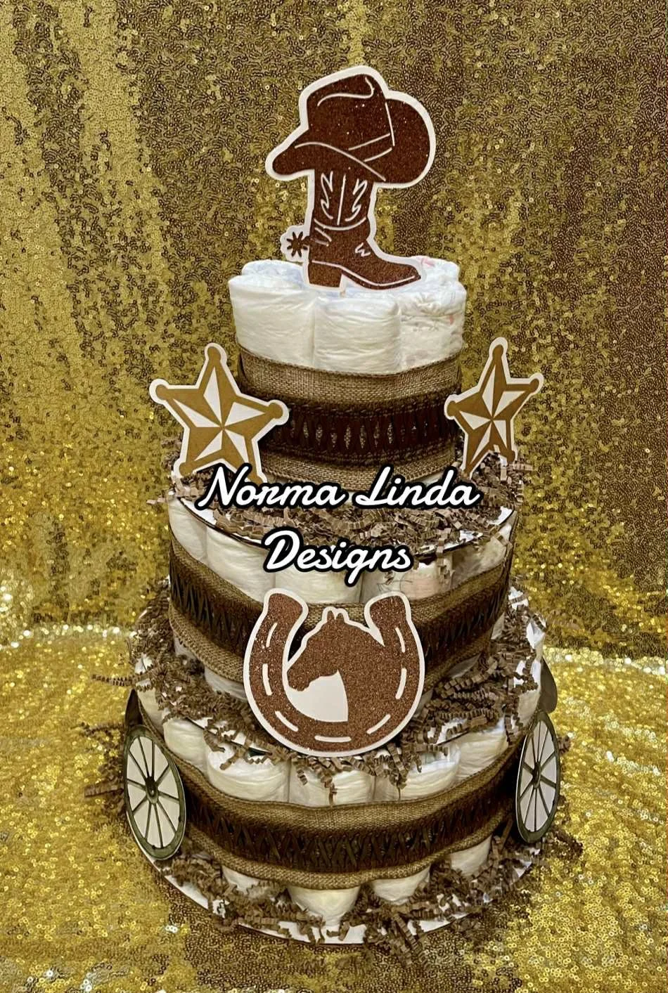 Cowboy theme diaper cake with brown and blue theme and cowboy boot topper