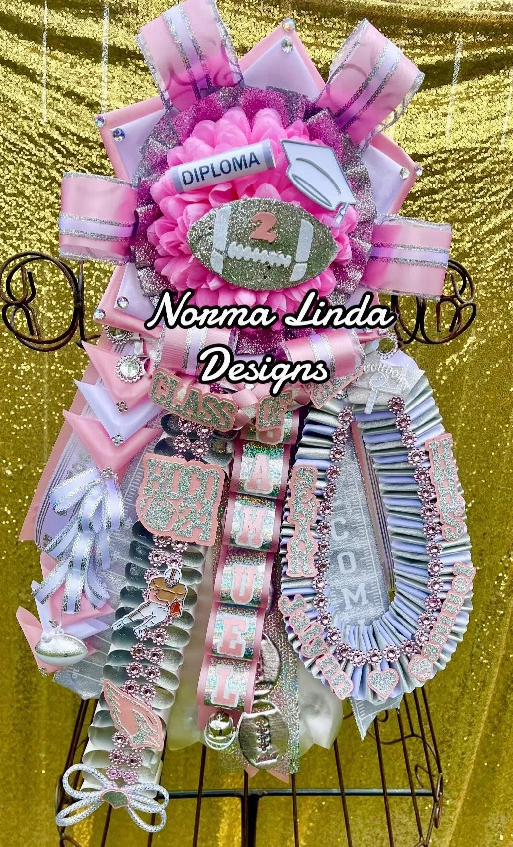 Mum featuring white and light pink accents. Centerpiece is football