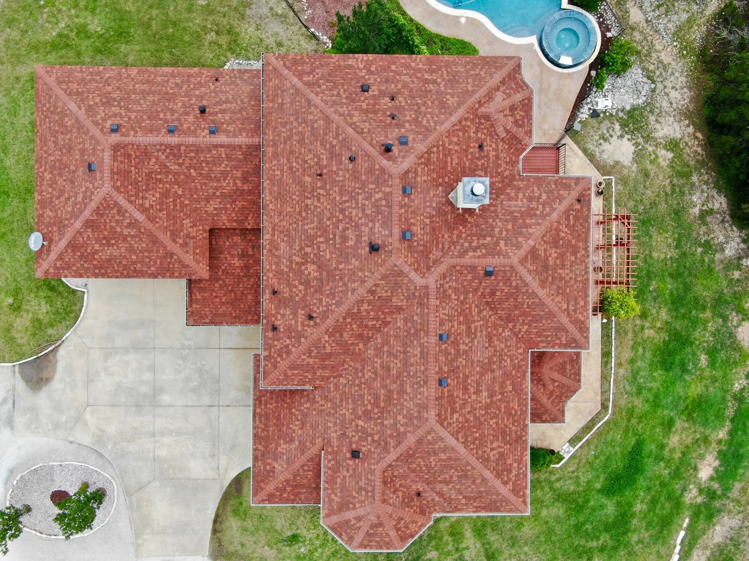 residential roof inspection and replacement in Leander TX aerial view of asphalt shingle roof