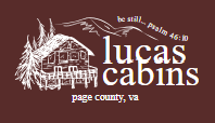 Lucas Cabins logo with a sketch of a cabin and pine trees, and the text 'be still—pass in,' 'lucas cabins,' and 'page county, va.'
