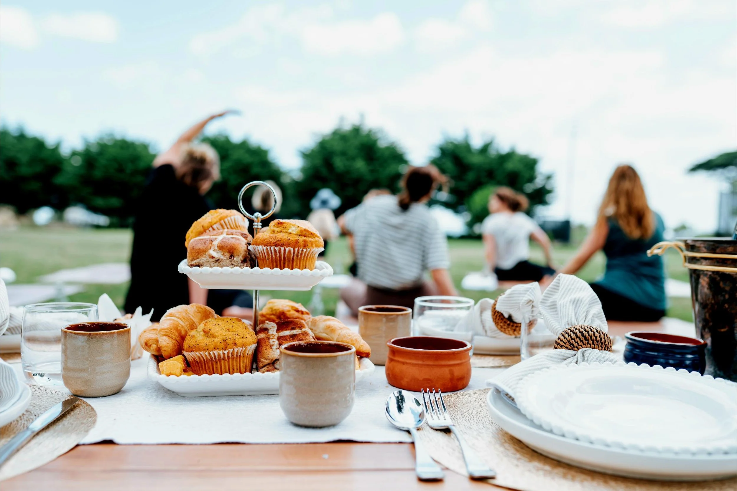 Luxury picnic experience in Melbourne featuring artisan pastries, premium tableware, and thoughtful outdoor styling.