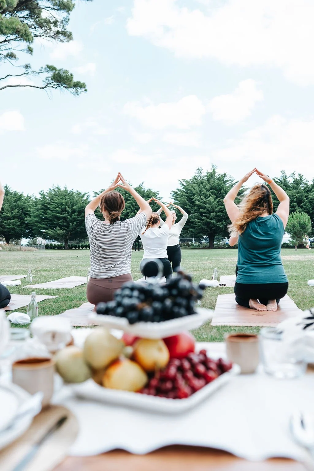 Outdoor Pilates experience in Melbourne featuring guided movement, wellness, and luxury picnic styling with fresh seasonal refreshments.