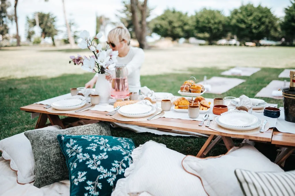 Signature picnic styling from a Pilates Picnic Melbourne experience, featuring elegant table settings, luxury décor, and beautiful outdoor surroundings.
