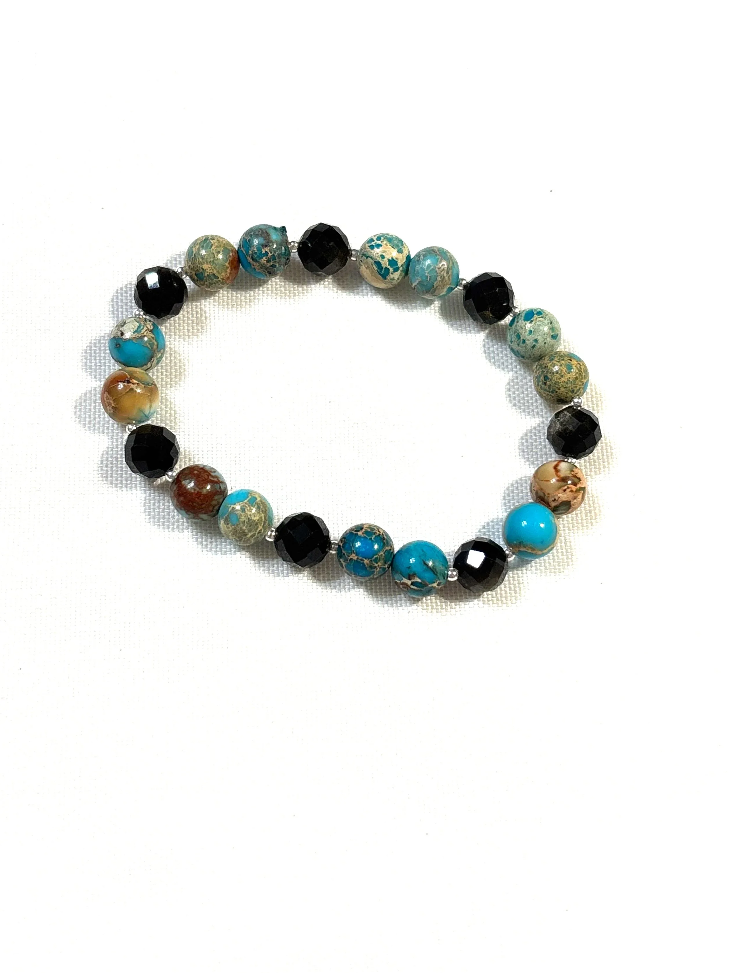 blue cracked stone with black and brown beads