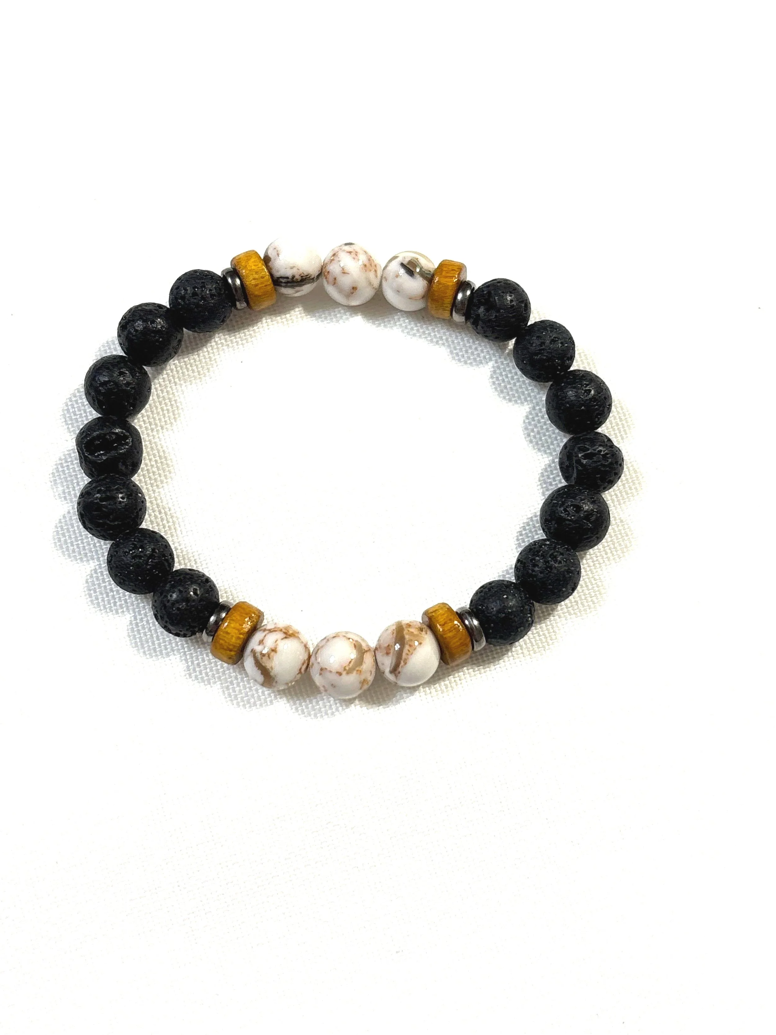 Black lava bead with brown and white stones.