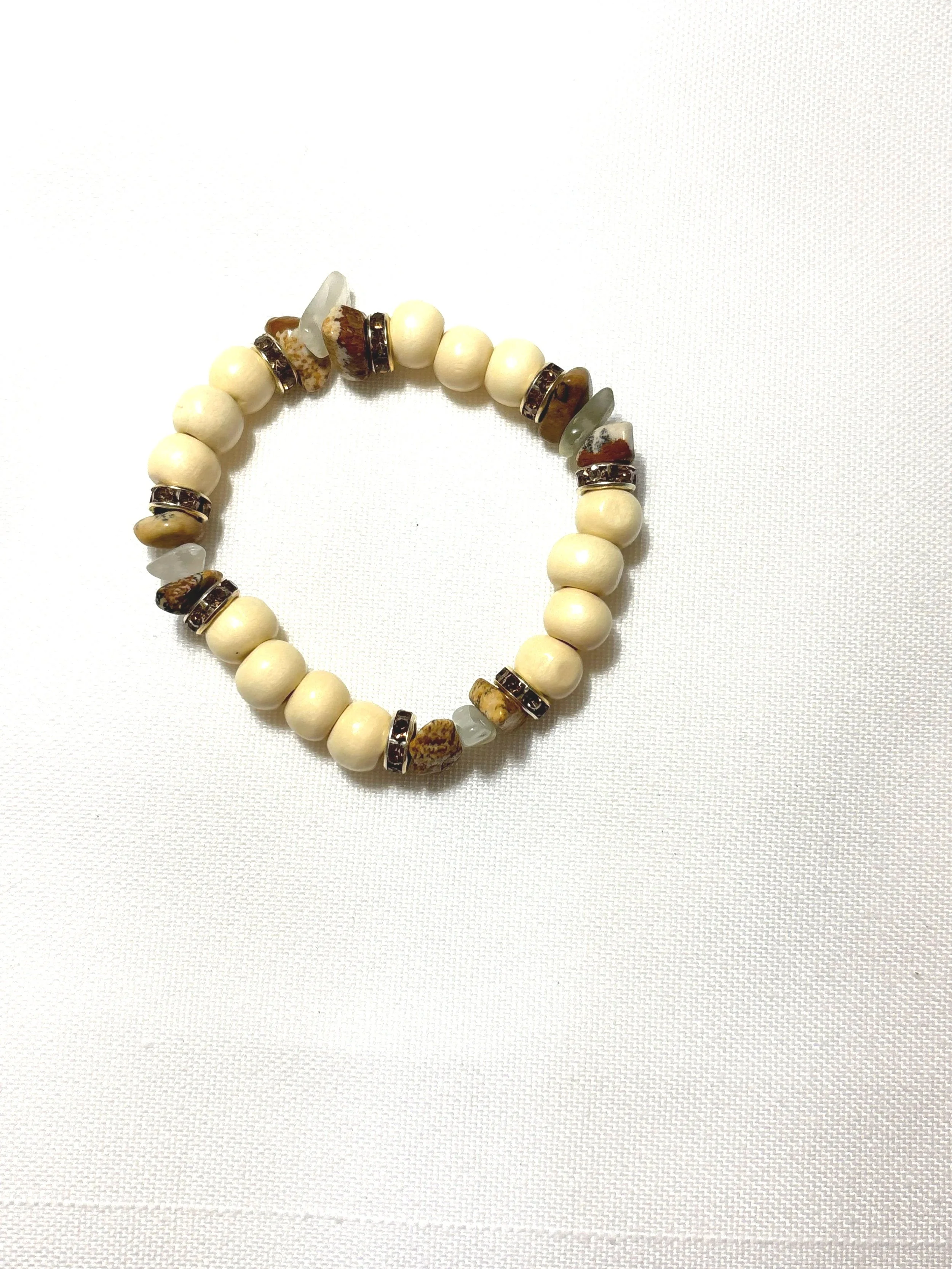 White wood bead with brown and clear polished rocks