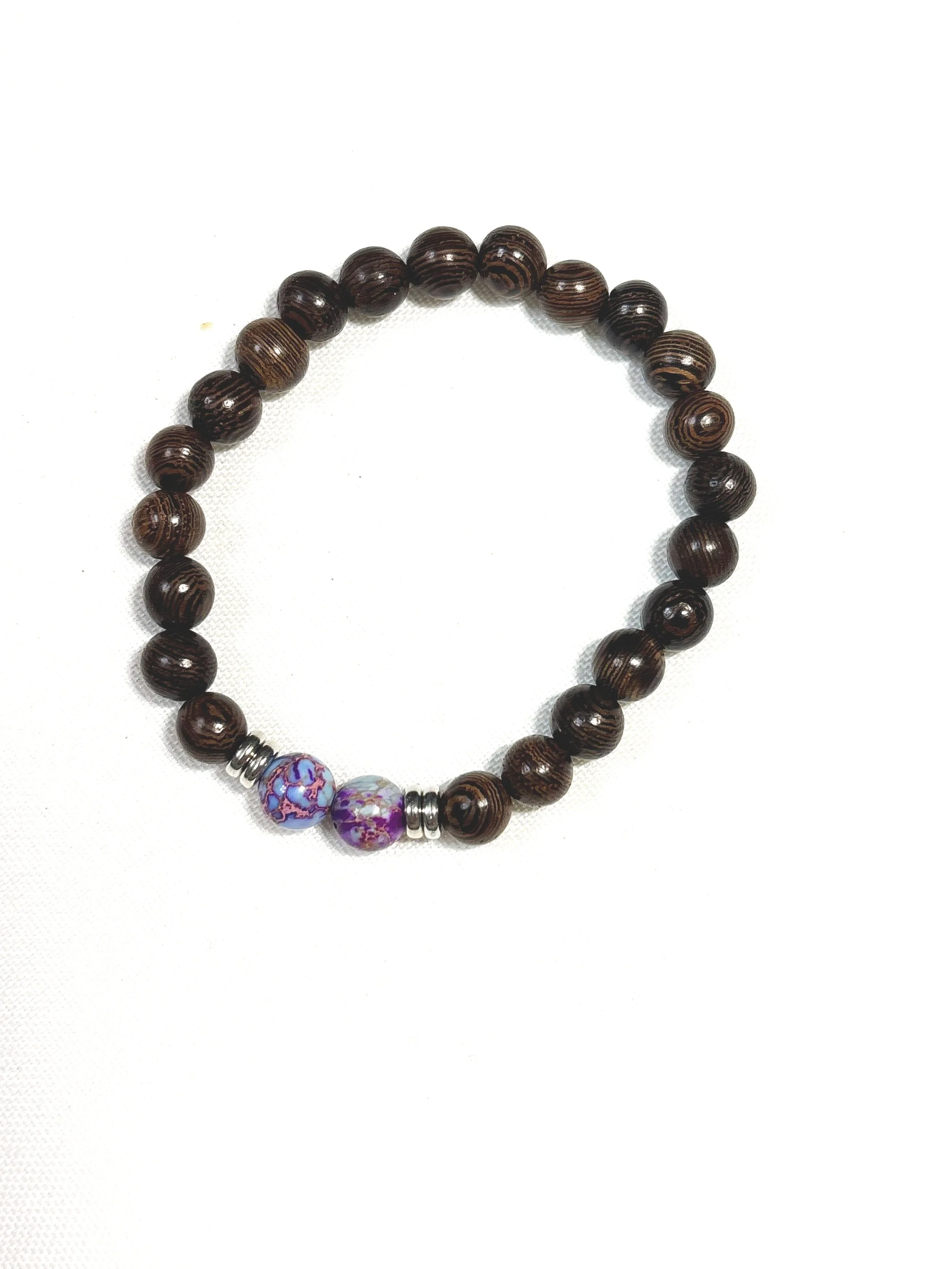 Dark Wood with purple emperor stone. 8mm