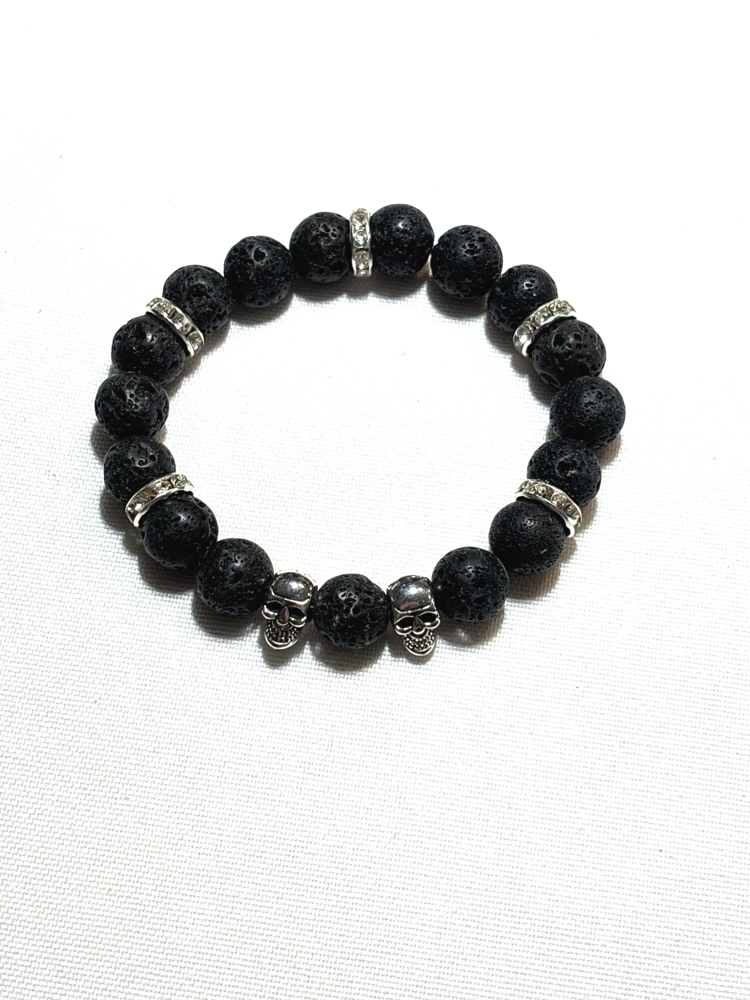 Lava bead with clear gems and skulls