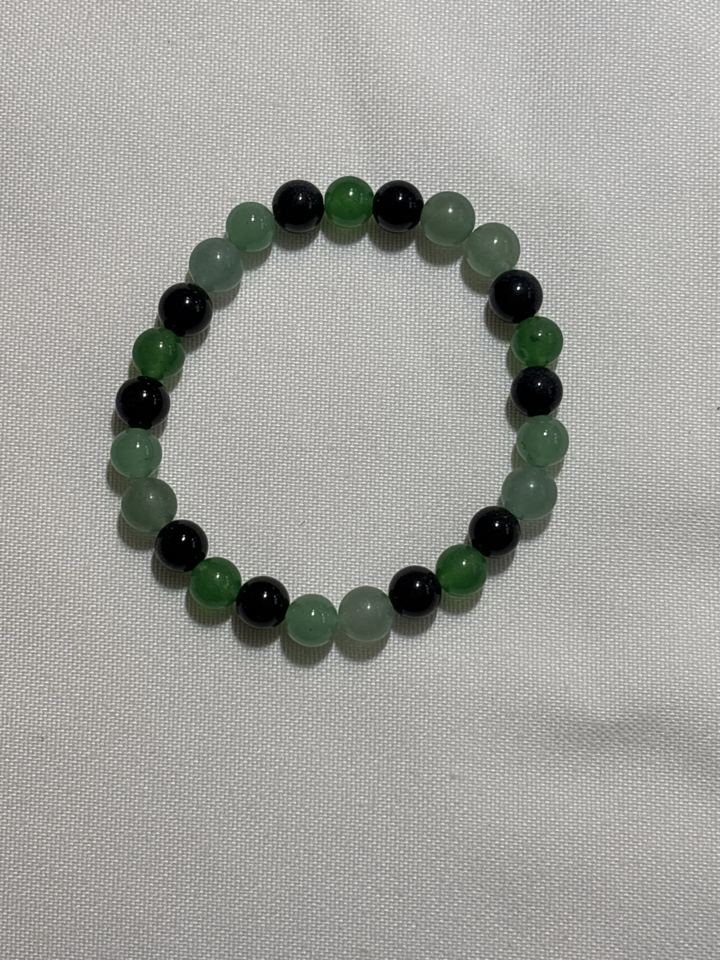 Green stone and obsidian bracelet