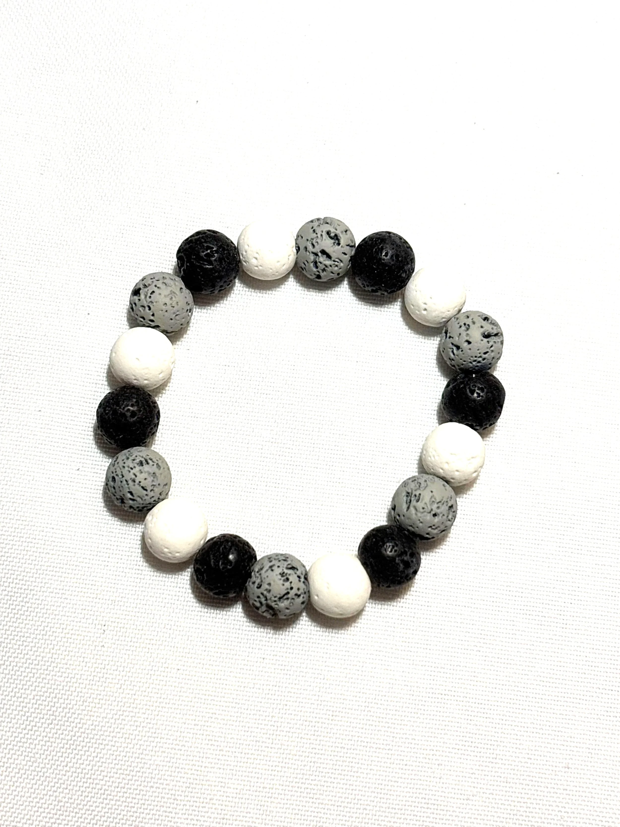 Black, gray and white lava bead