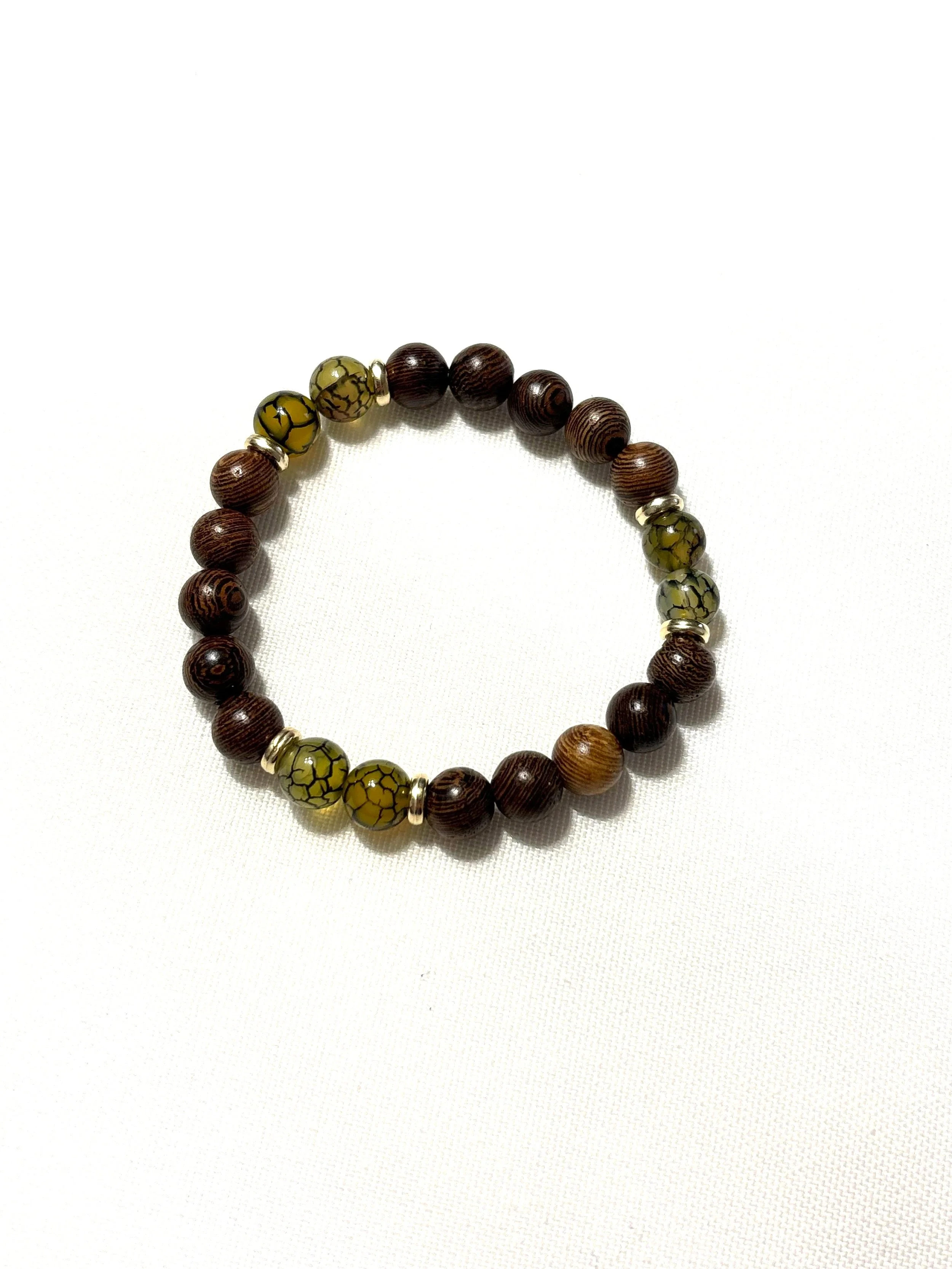 Dark wood bead with cracked yellow stone