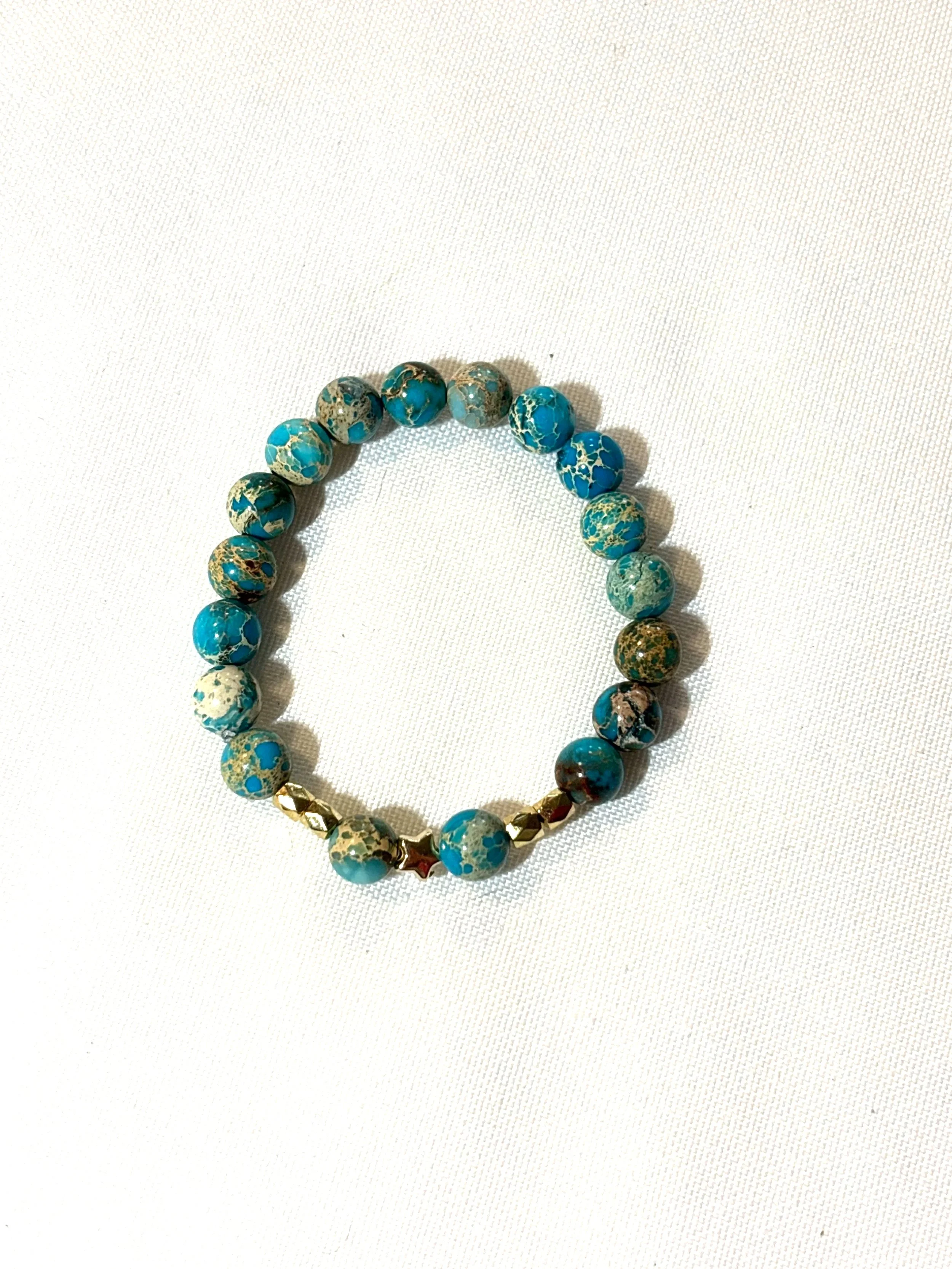 Turquoise beads with gold charms