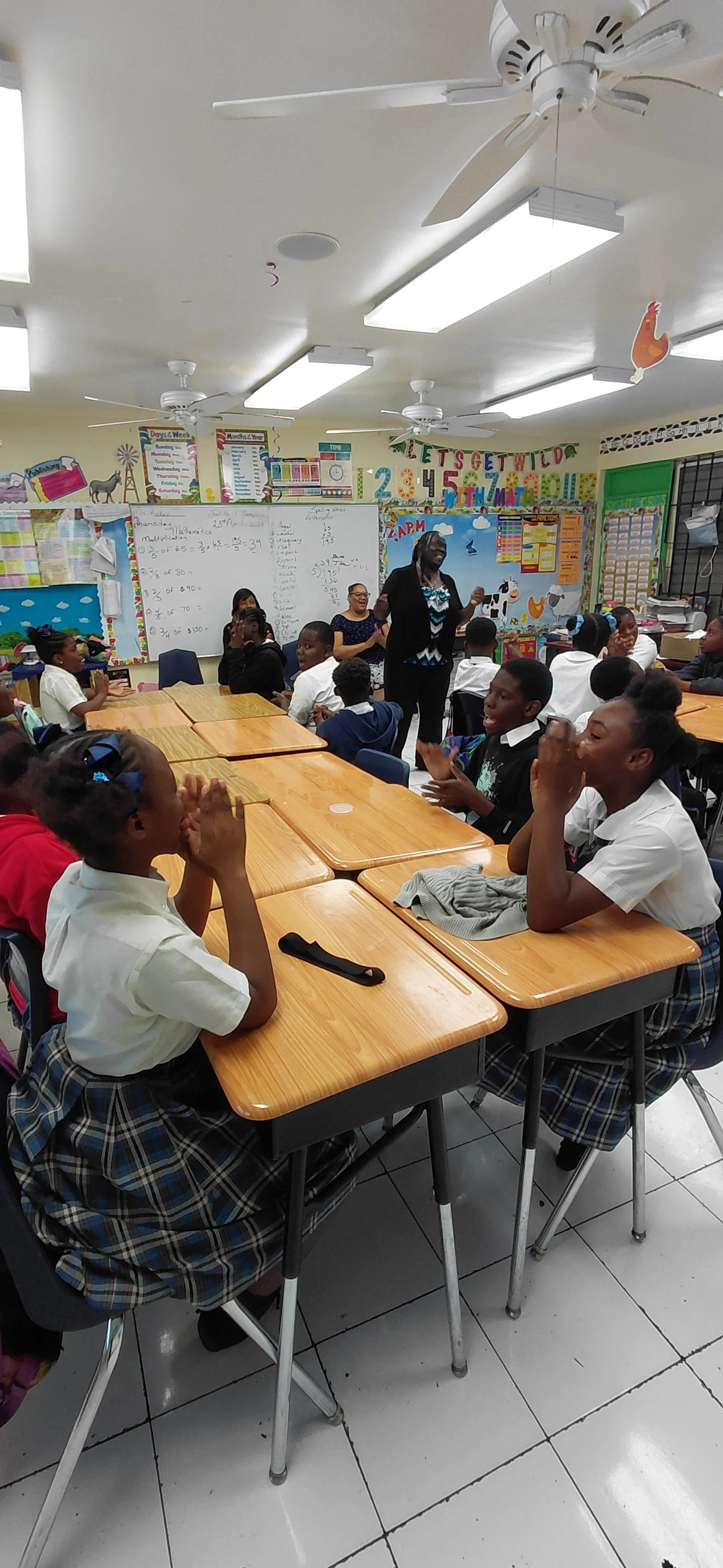 Minister Linda Gibson singing with the students.