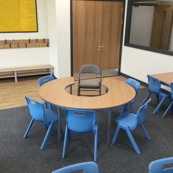 Durable carpet flooring installed in a classroom providing comfortable and practical flooring for schools