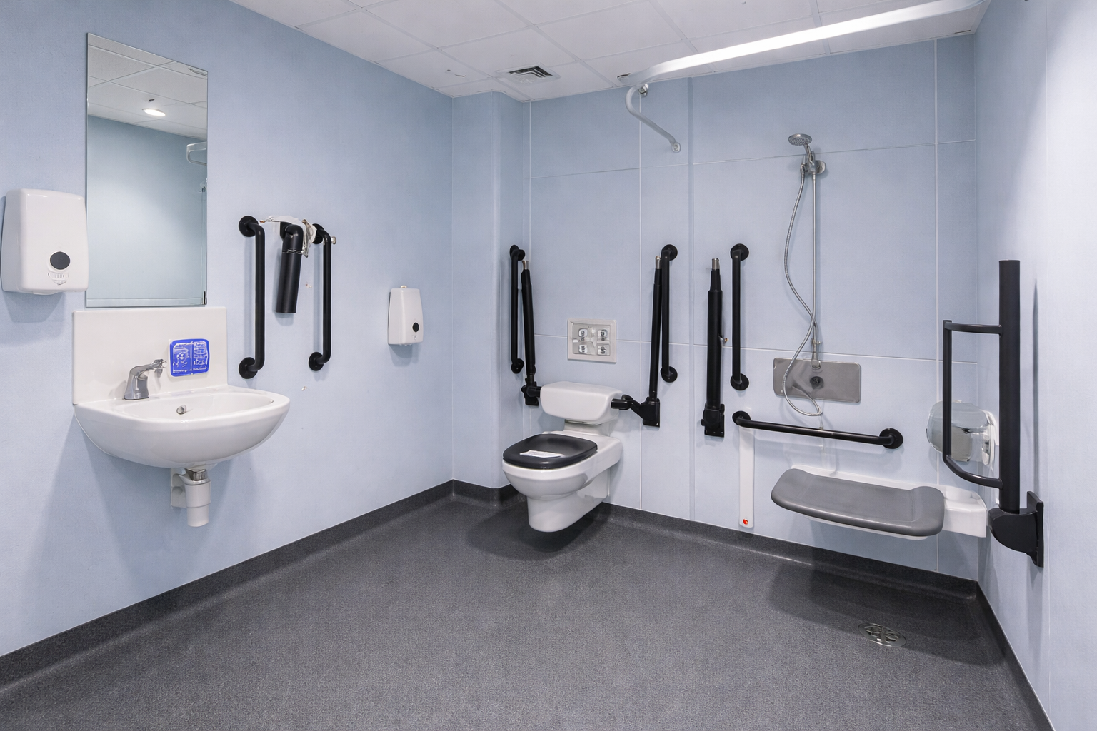 Non slip safety vinyl flooring installed in an accessible hospital wet room with grab rails and shower area