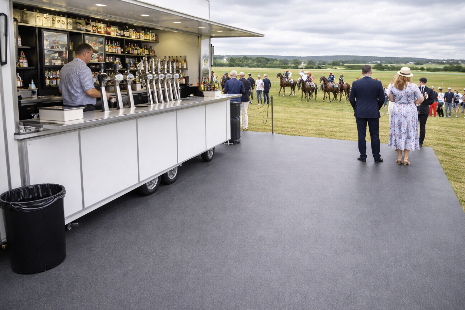 Slip-resistant vinyl flooring used at an outdoor event with a mobile bar at a horse racing venue, durable and easy-to-clean surface for high-traffic areas in Surrey and South West London