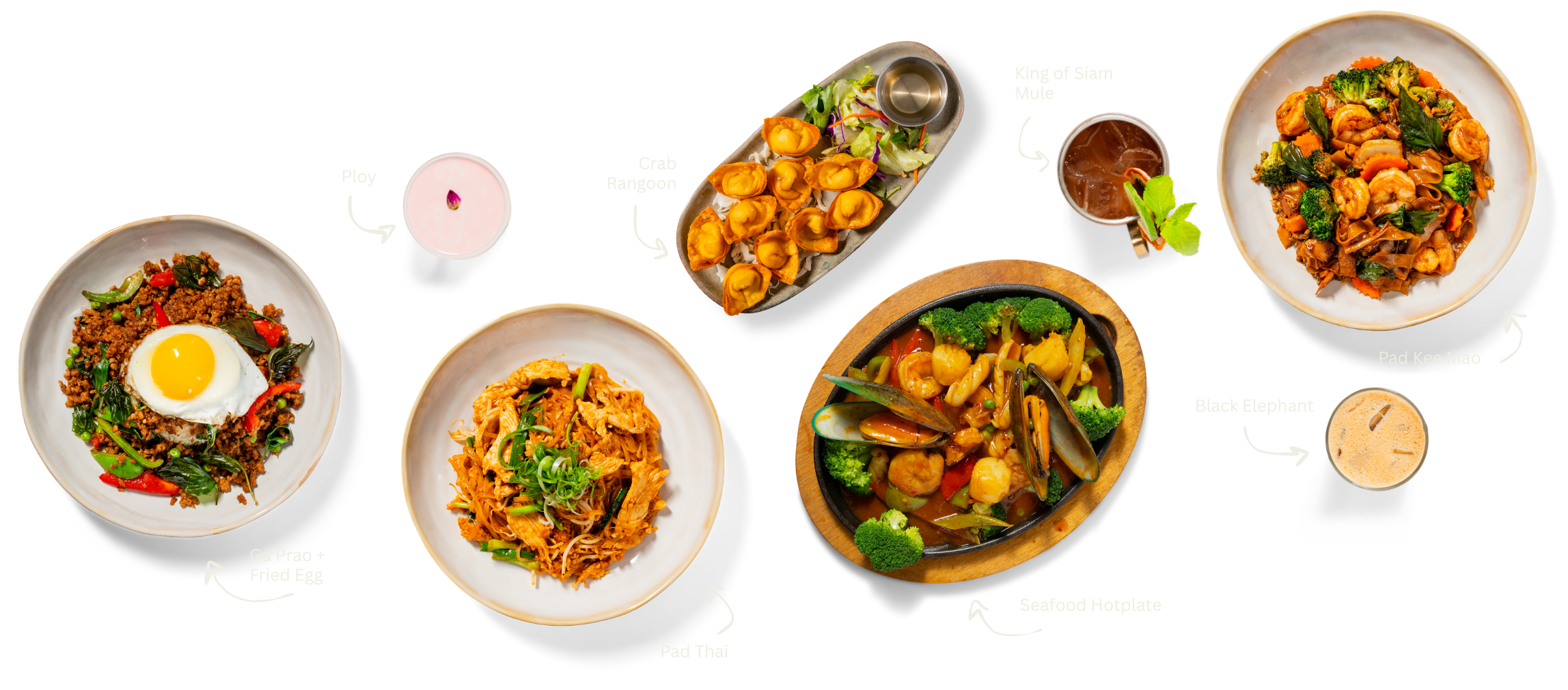 Arrangement of Thai dishes and drinks: Ga Pleo with fried egg, Pad Thai, seafood hotplate, Pad Kee Mao, King of Slam Mule, Black Elephant, Crab Rangoon, Ploy candle.