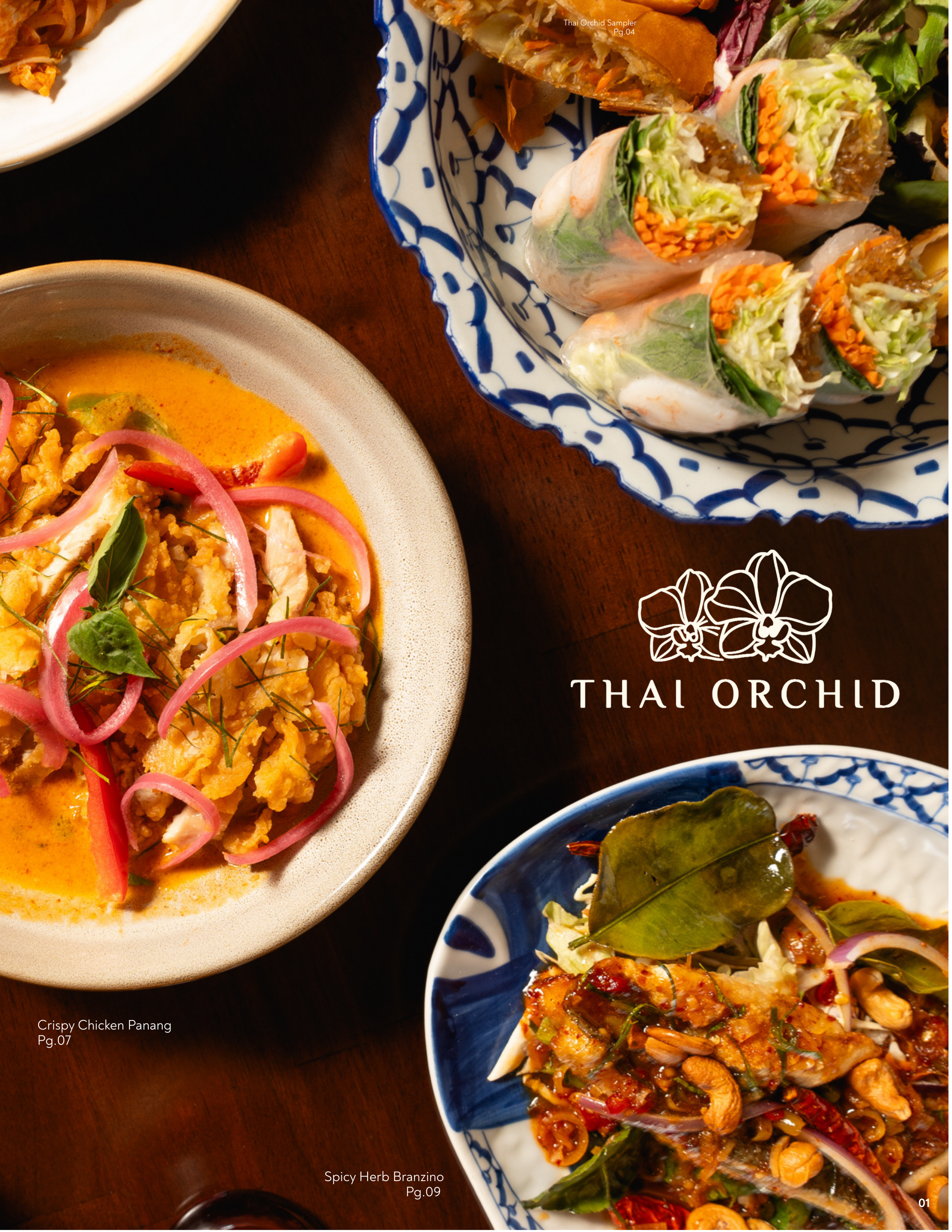 Assorted Thai dishes on a wooden table, including spring rolls, spicy herb branzino, and crispy chicken panang, with the Thai Orchid logo.