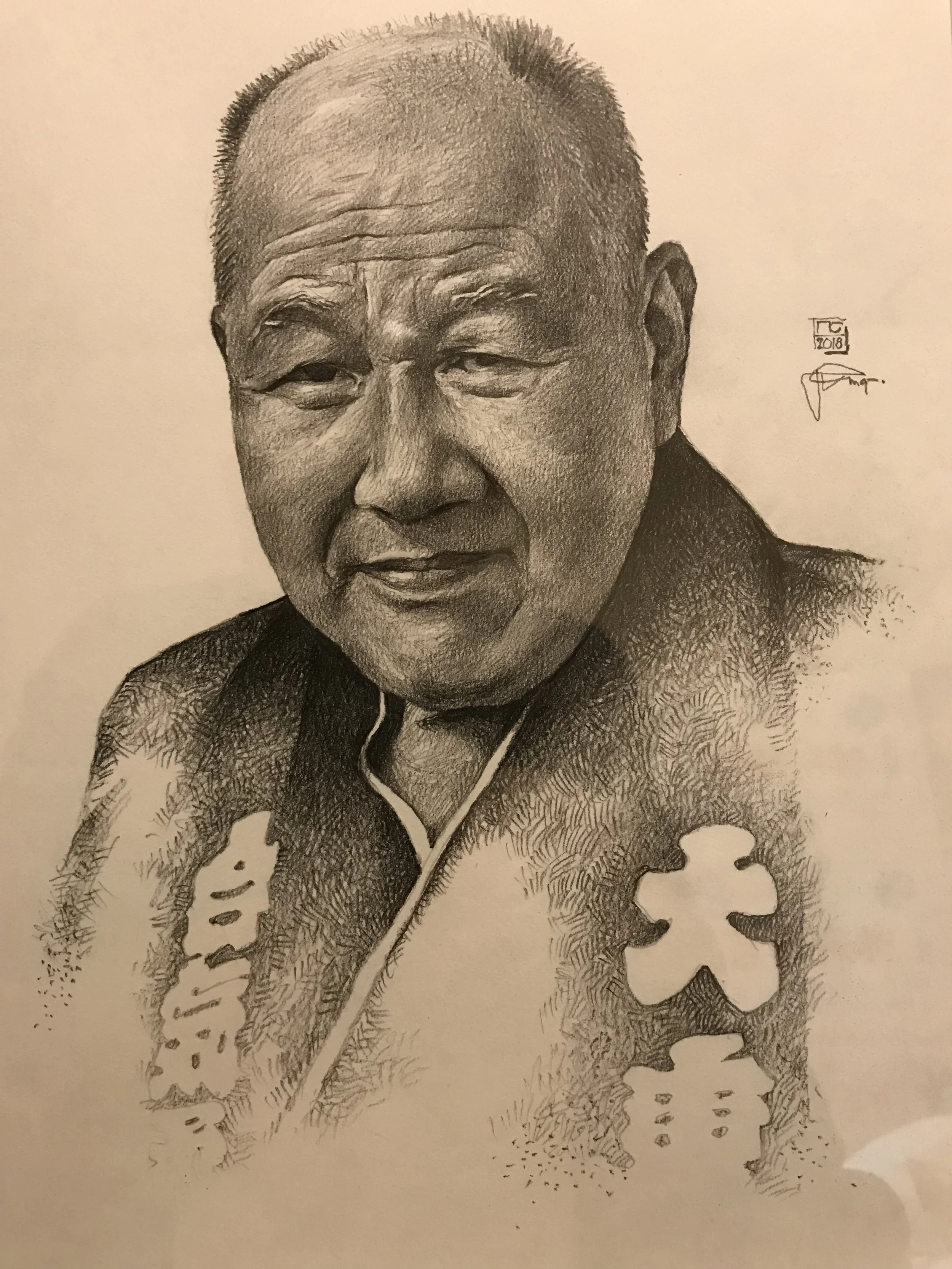 A detailed black and white portrait sketch of an elderly Asian man with short hair, wearing a traditional patterned garment.