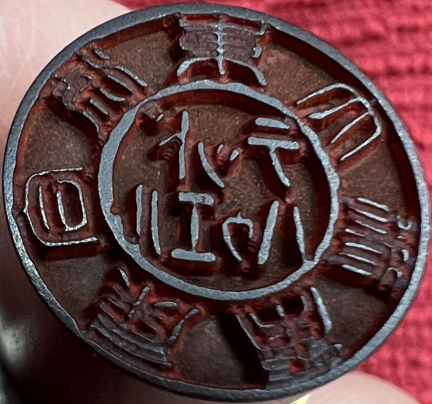 Close-up of a metal stamp with the words 'ROCKFORD' and a logo, likely an automotive or manufacturing stamp.