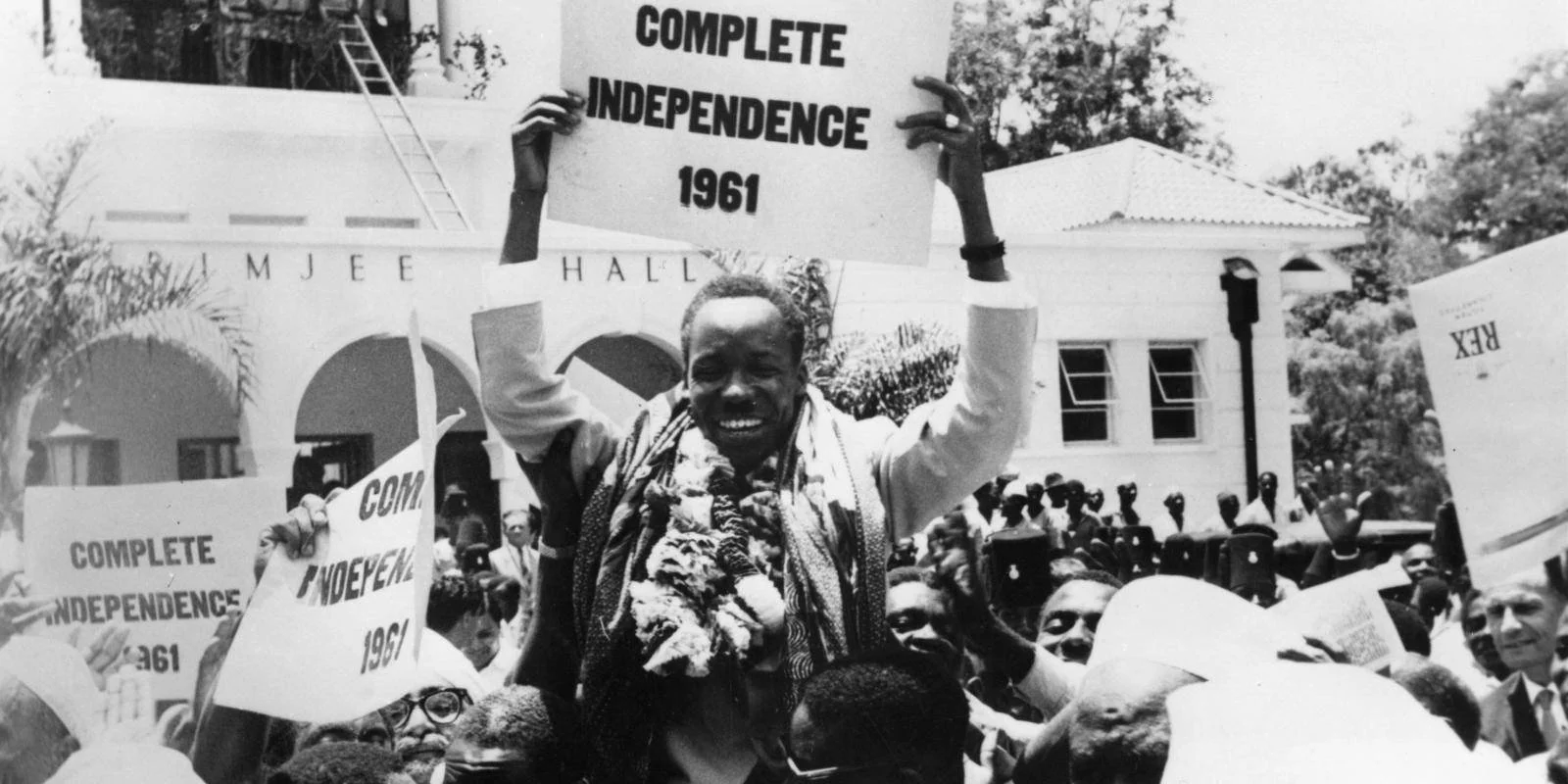 March 29, 1961;  ‍Premiere of Tanganyika (Tanzania), Julius Nyerere holds a sign saying "COMPLETE INDEPENDENCE 1961", celebrating with the crowd after having achieved state sovereignty for the people.  Image credit:  United Press International