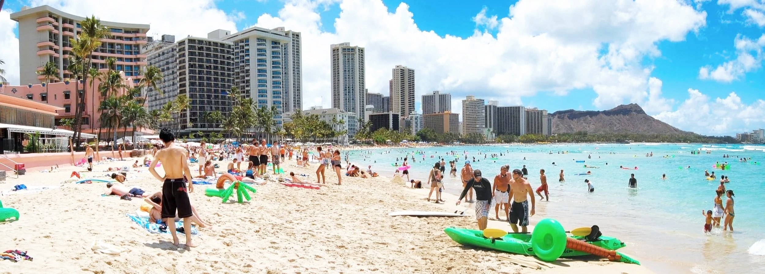 Tourists swimming at Waikiki beach, in Honolulu.