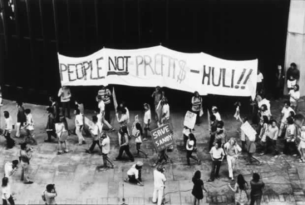 Black and white photograph of a protest at the Honolulu Capitol Building, by Ed Greevy.