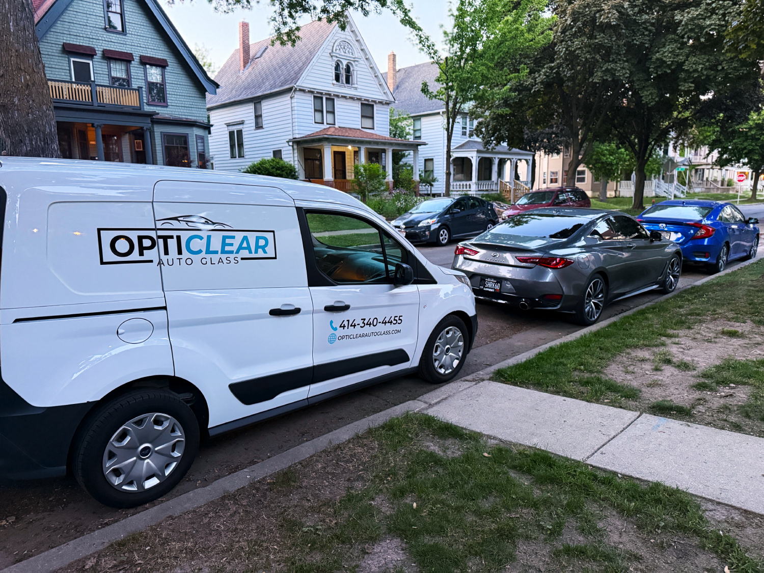 Mobile windshield replacement service by OptiClear Auto Glass at a residential home in Milwaukee, WI.