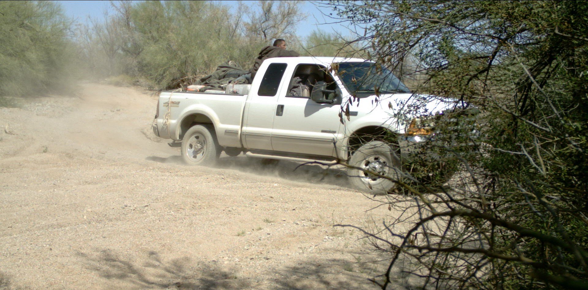A load vehicle drove past Ryan and Richard in the middle of the day, with marijuana bundles visible in the back. The proximity underscored how openly the network operated. After a short pursuit, we seized approximately 1,800 pounds of marijuana from 