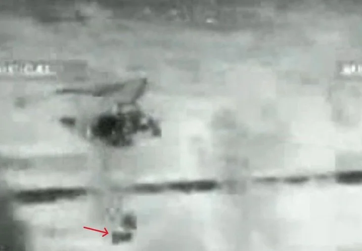The network didn't always use million dollar airplanes to smuggle their narcotics. This nighttime surveillance photo shows an ultralight aircraft fly into the US and drop its drug cargo, marked by the red arrow to a waiting ground team to transport i