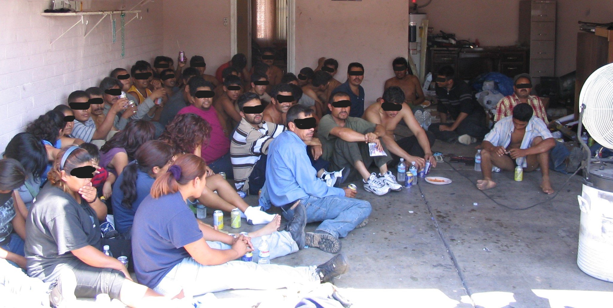 The human cost. Drop houses held large groups like this. They were staged, controlled, and moved through the network as cargo. Conditions were often degrading, while the system profited from every step.