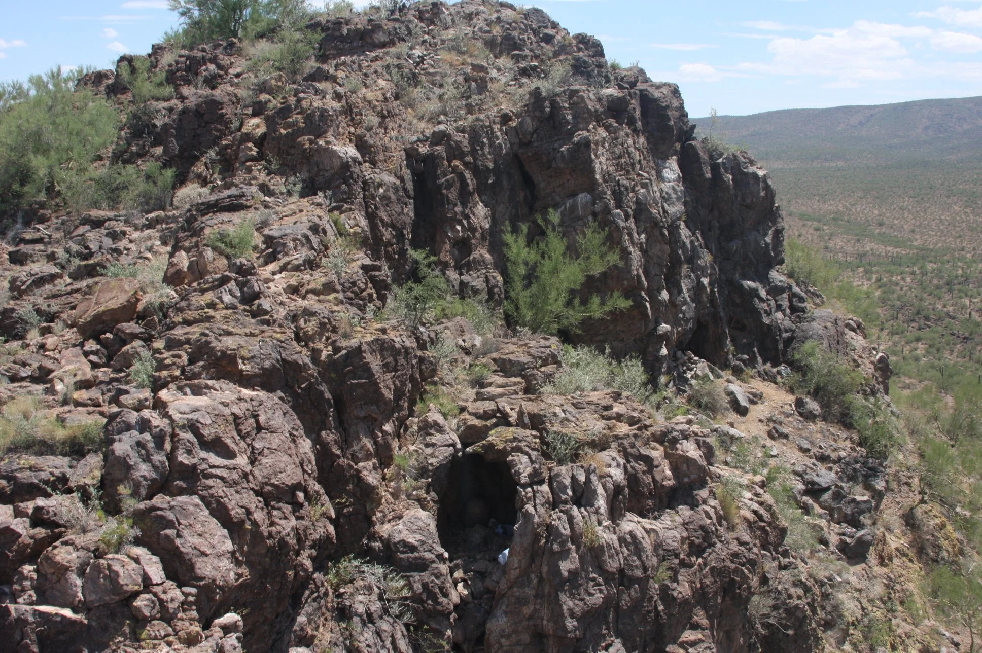 A cave overlooking the pipeline route where scouts lived in two-week rotations. Positions like this provided continuous surveillance across the corridor despite the harsh conditions.

