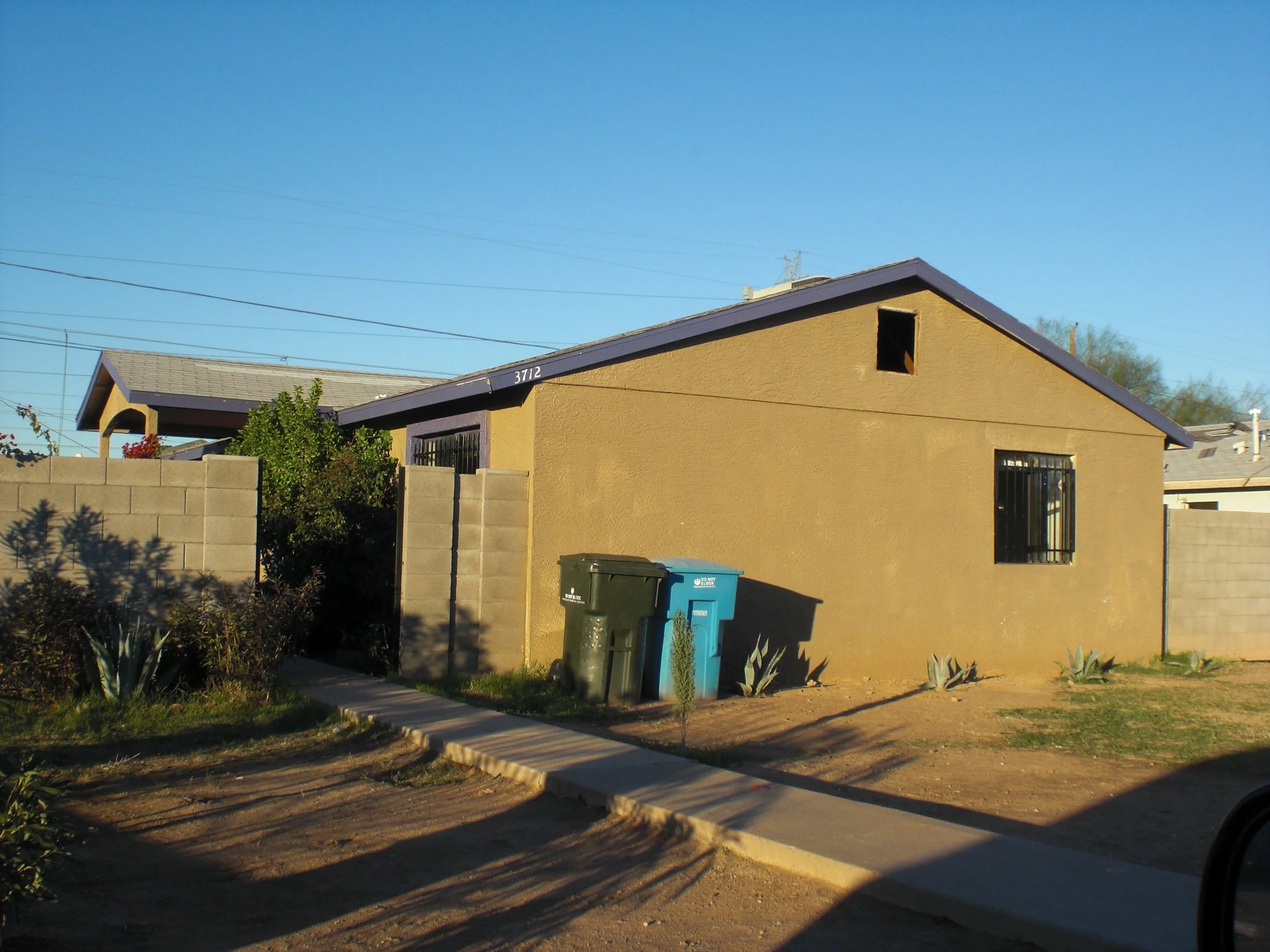 A suburban house in the Phoenix area. The brown stucco matches the desert landscape and the hundreds of other homes identical to it in the neighborhood. Inside was much more sinister than its innocent outward appearance.